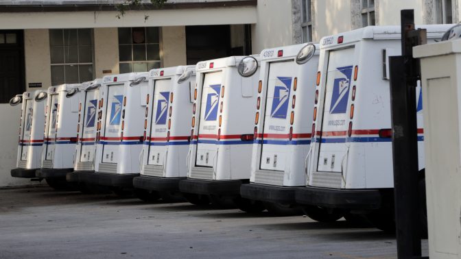 States sue USPS over its decision to buy gas-powered trucks : NPR