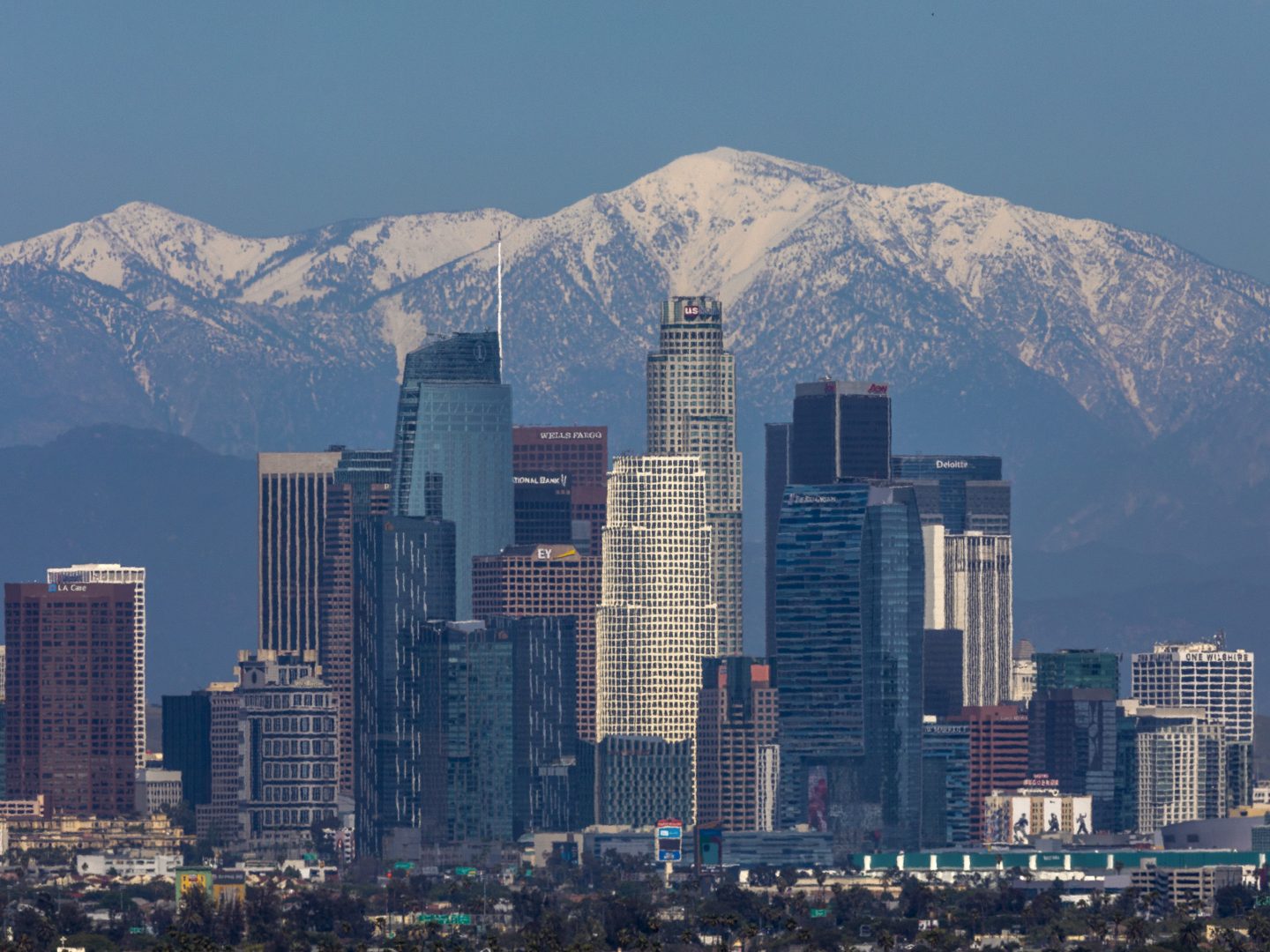 The San Gabriel Mountains are seen under a clear sky beyond downtown Los Angeles. Air quality in the U.S. and elsewhere has been improved by reduced traffic from coronavirus restrictions and weeks of rainstorms.