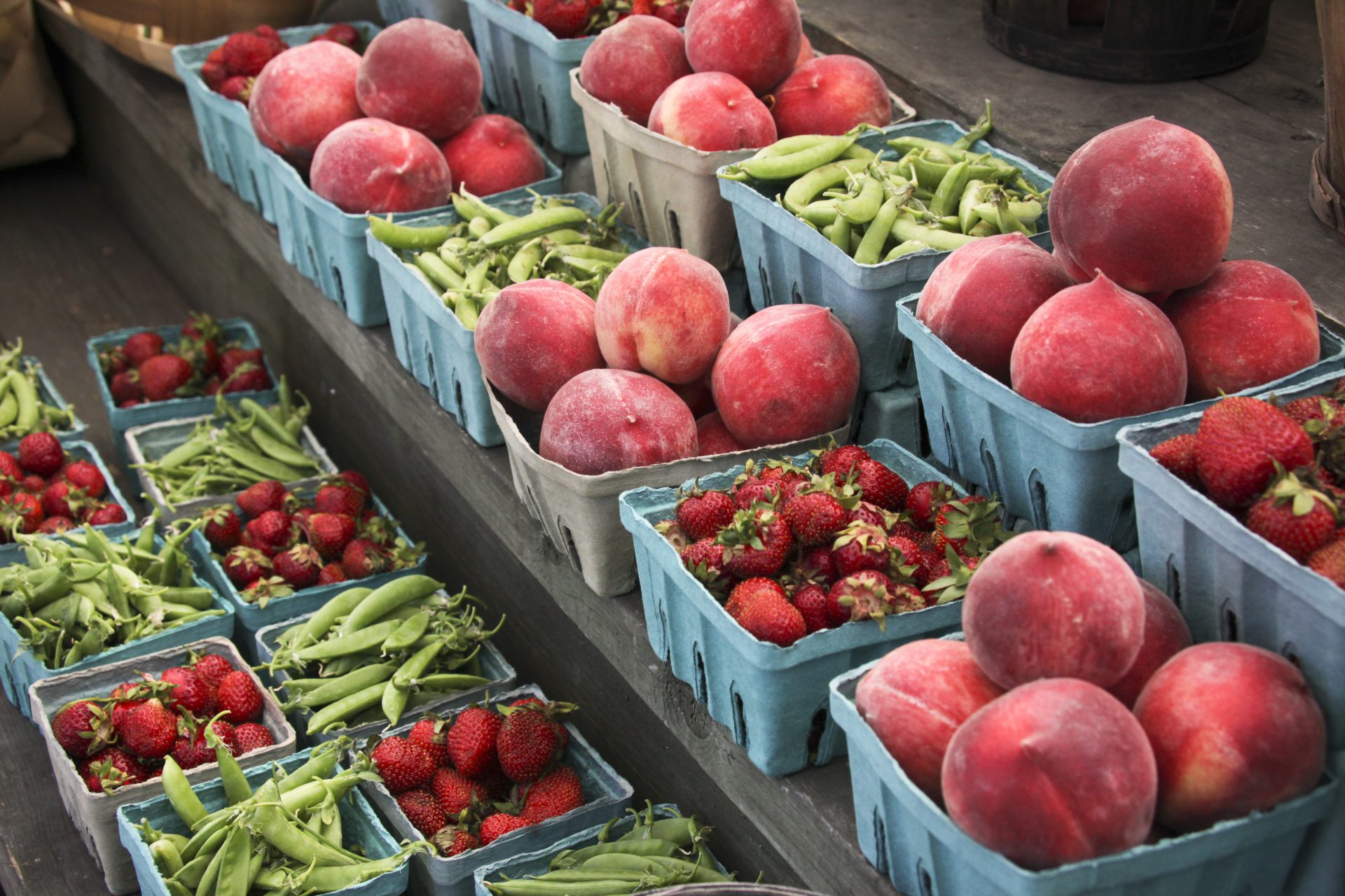 Peaches, strawberries, and snap peas are for sale at a roadside market outside Gettysburg, Pa., Saturday, June 8, 2013.