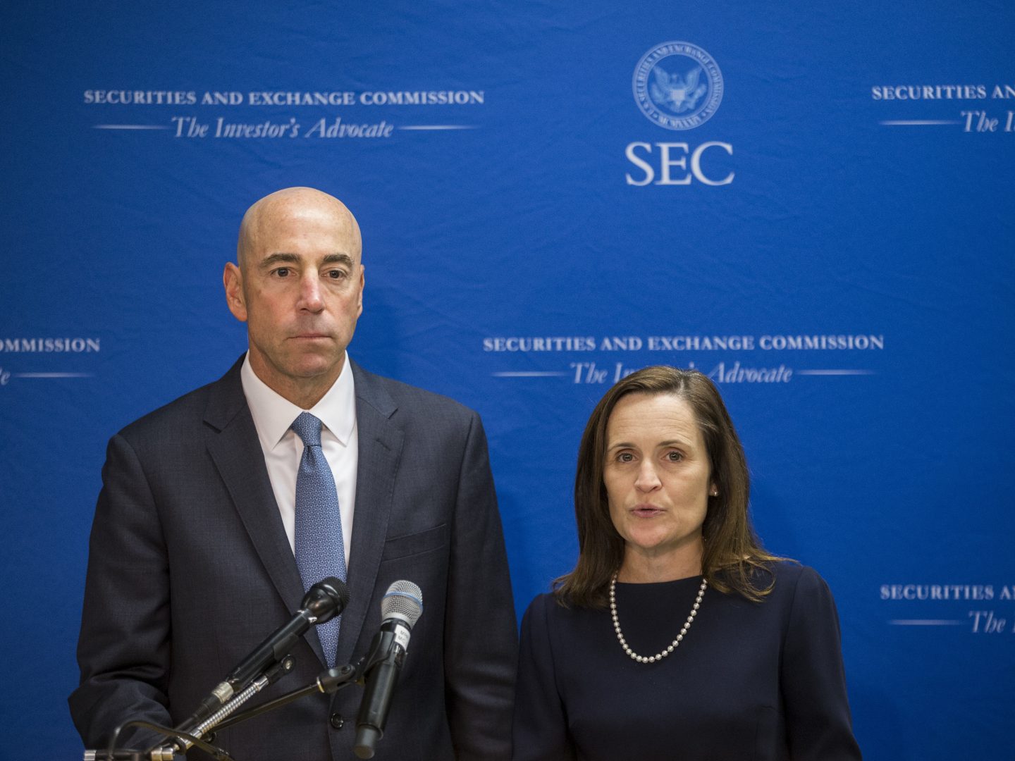 Securities and Exchange Commission Co-Directors of Enforcement Stephanie Avakian and Steven Peikin speak during a news conference in 2018. Avakian and Peikin say their office is aggressively pursuing enforcement related to the coronavirus pandemic.
