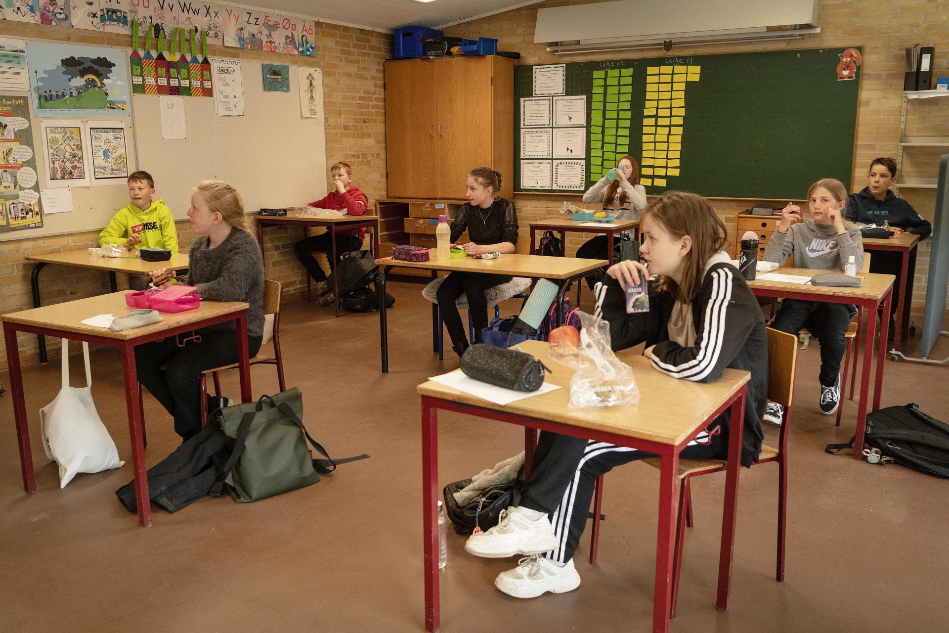 Schoolchildren have lunch at the Korshoejskolen Public school in Randers, Denmark. Denmark began reopening schools on April 15.