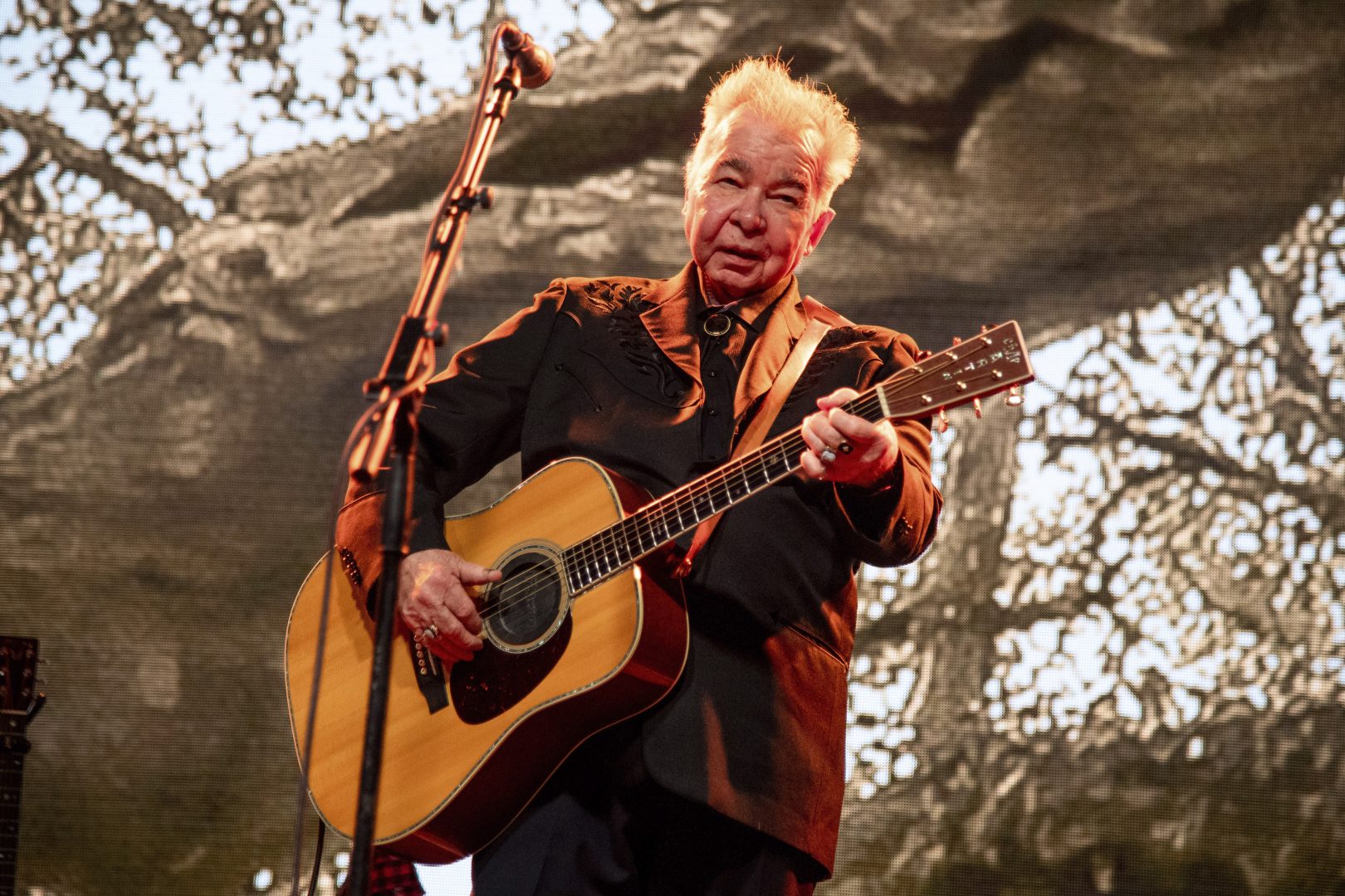 FILE - This June 15, 2019 file photo shows John Prine performing at the Bonnaroo Music and Arts Festival in Manchester, Tenn.  Prine died Tuesday, April 7, 2020, from complications of the coronavirus. He was 73.  