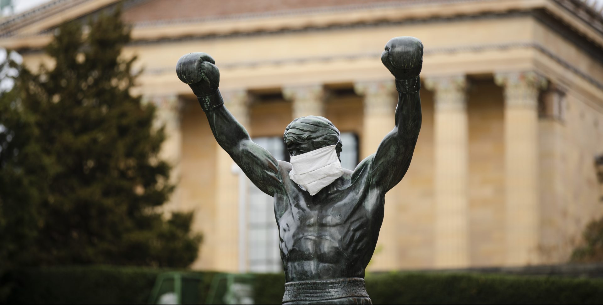 The Rocky statue is outfitted with mock surgical face mask at the Philadelphia Art Museum in Philadelphia, Tuesday, April 14, 2020.