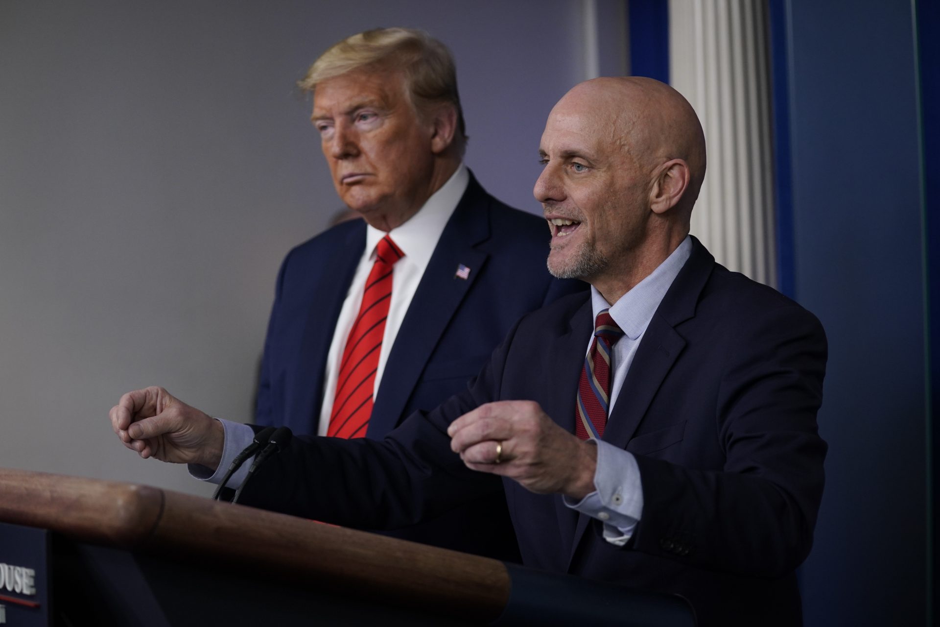 President Donald Trump, left, listens as Food and Drug Administration Commissioner Dr. Stephen Hahn speaks during press briefing with the coronavirus task force, at the White House, Thursday, March 19, 2020, in Washington.