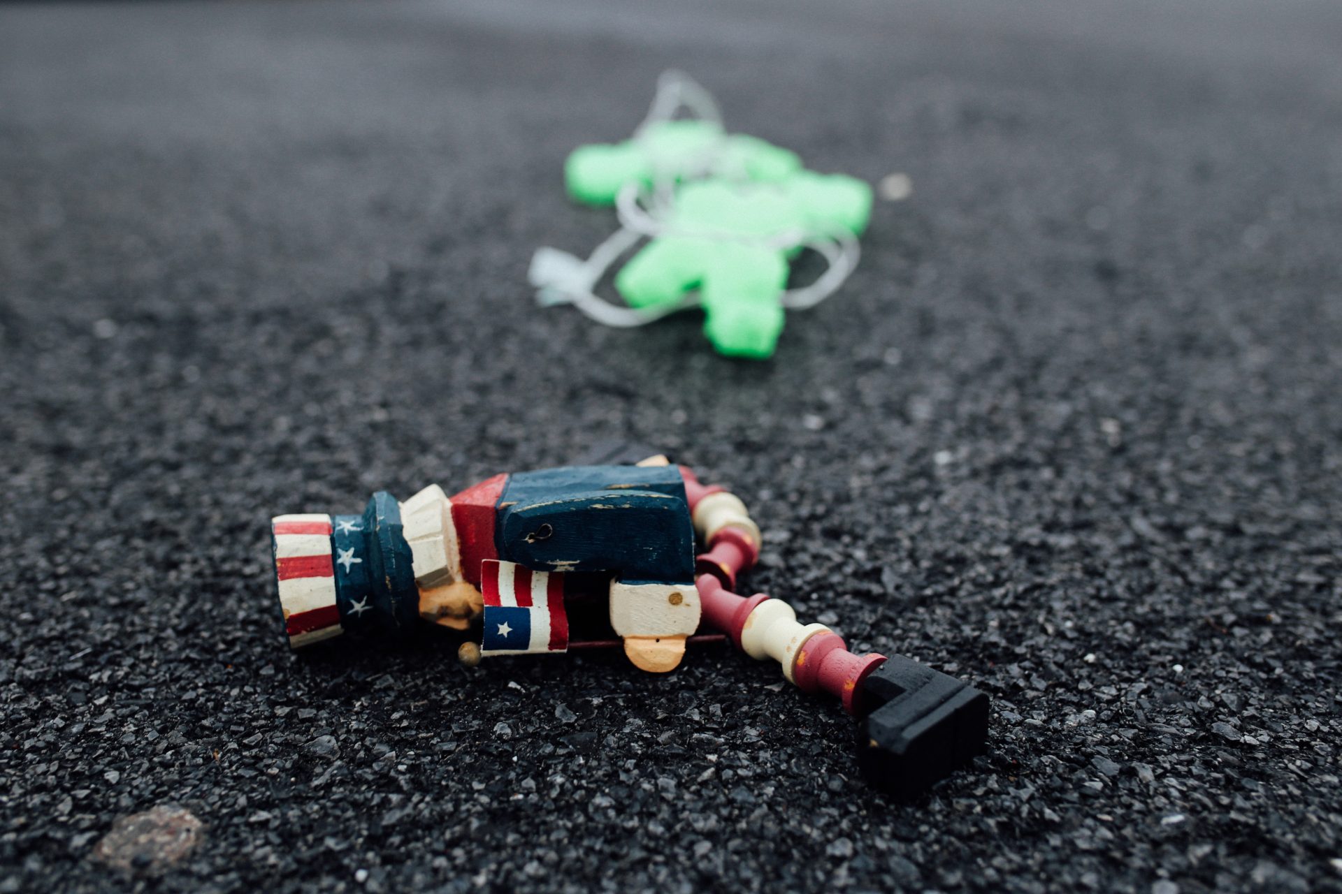 A wooden Uncle Sam figure lies near a Community Aid drop-off box. The container is overflowing with donations on April 1, 2020, because the items aren't being picked up during the coronavirus outbreak. The bin is located in the parking lot of the Swatara Church of God outside Harrisburg.