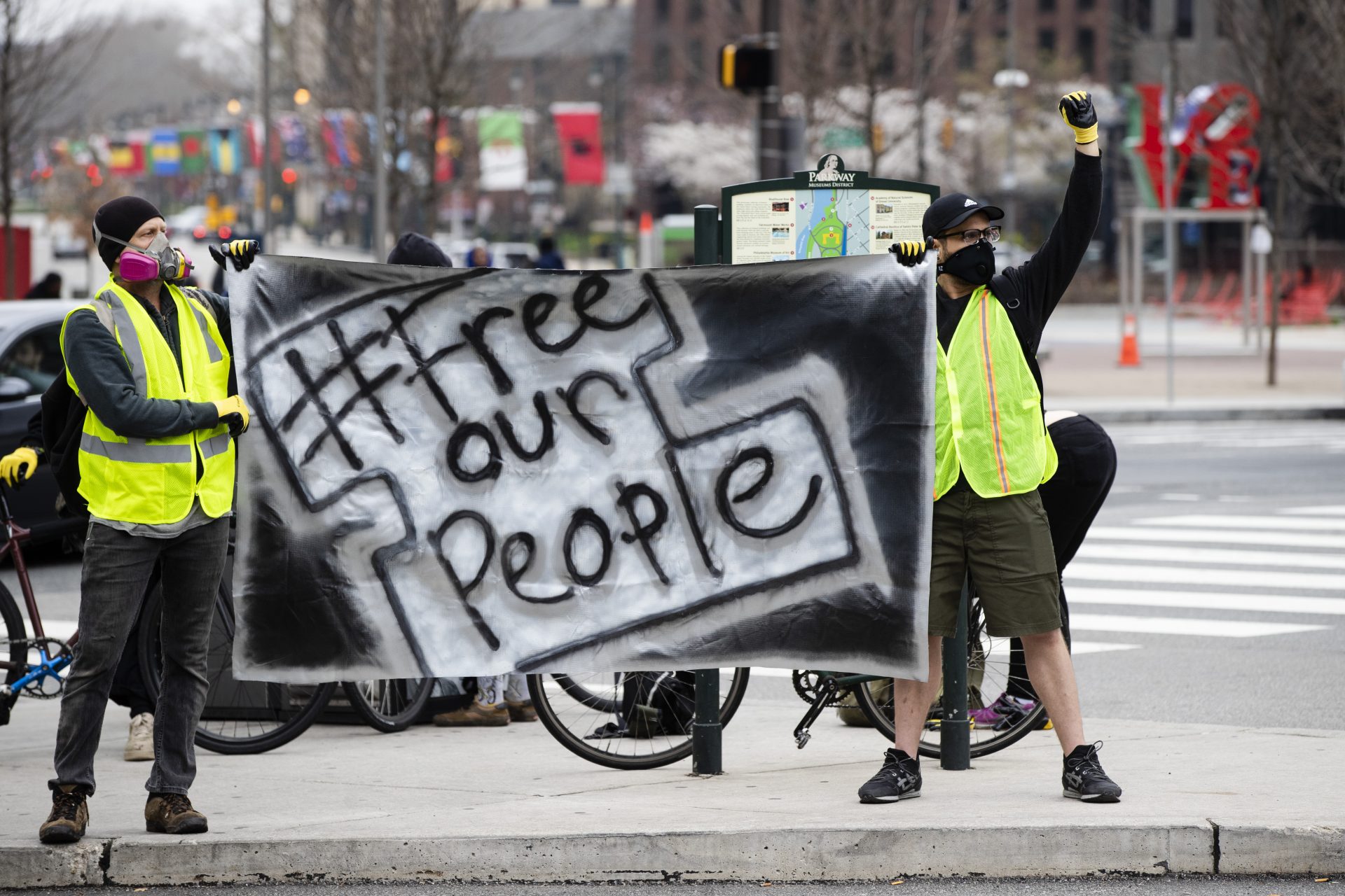 Protesters call for officials to release people from jails, prisons, and immigration detention centers in response to the coronavirus, as they demonstrate outside City Hall in Philadelphia, Monday, March 30, 2020.