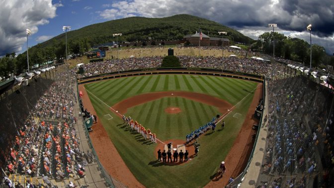 FILE PHOTO: In this Sunday, Aug. 25, 2019, file photo, River Ridge, Louisiana, lines the third baseline and Curacao lines the first baseline during team introductions before the Little League World Series Championship game at Lamade Stadium in South Williamsport, Pa. The 2020 Little League World Series and the championship tournaments in six other Little League divisions have been canceled because of the new coronavirus pandemic.