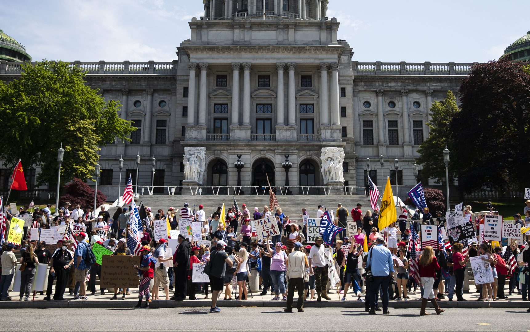 Protesters demonstrate during a rally against Pennsylvania's coronavirus stay-at-home order at the state Capitol in Harrisburg, Pa., Friday, May 15, 2020.