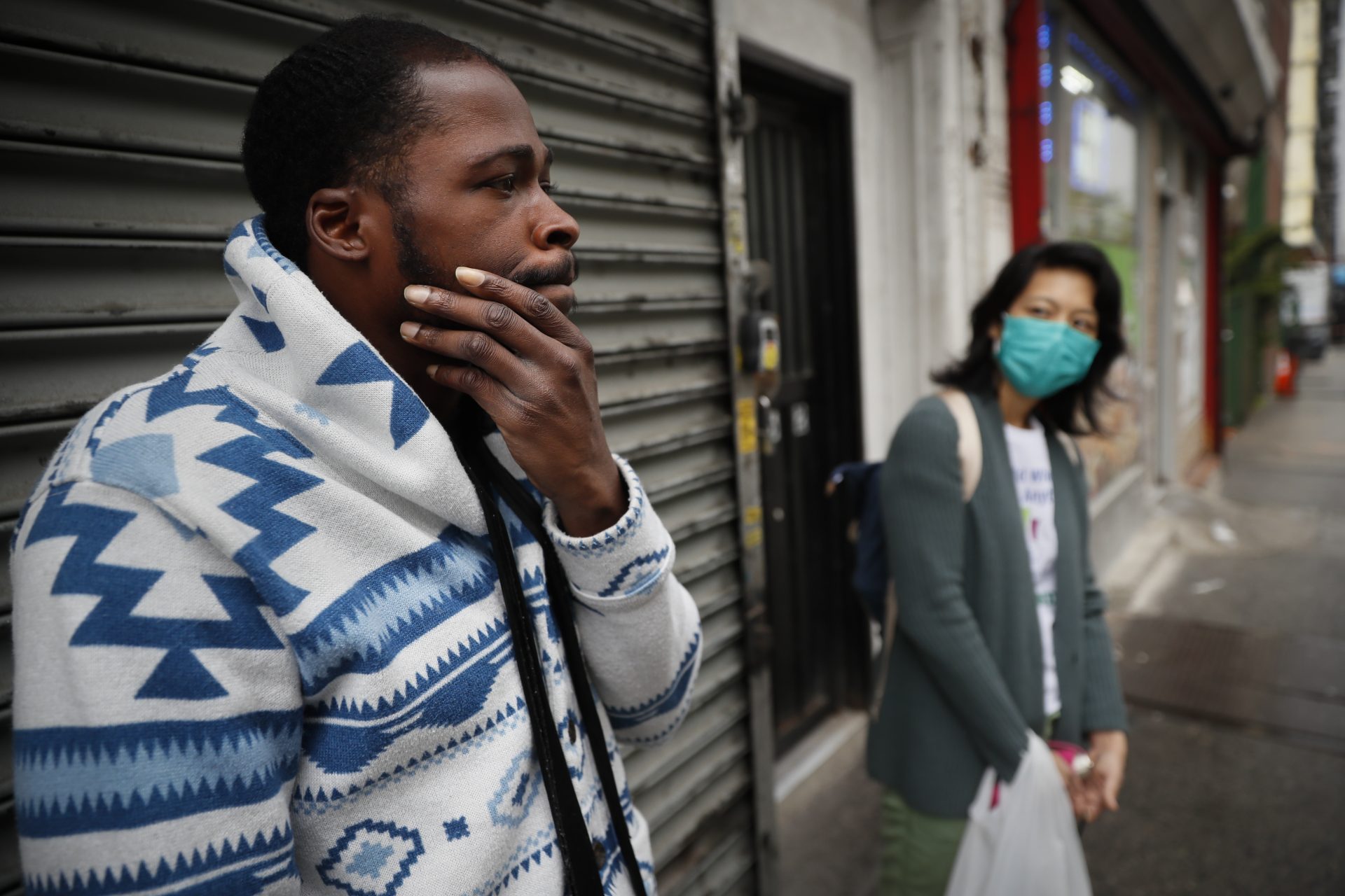 Brandon, 32, left, who lives with schizophrenia stands with Dr. Jeanie Tse, chief medical officer at the Institute for Community Living, right, as she makes her rounds treating patients, Wednesday, May 6, 2020, in the Brooklyn borough of New York.