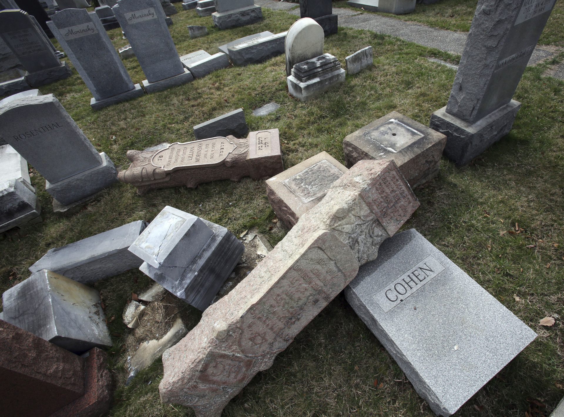 In this Feb. 27, 2017 file photo, headstones toppled and damaged by vandals lie on the ground at Mount Carmel Cemetery in Philadelphia. The Anti-Defamation League is reporting a 57 percent increase in anti-Semitic incidents in the U.S. in 2017, the highest tally that the Jewish civil rights group has counted in more than two decades, according to data it released on Tuesday, Feb. 27, 2018.