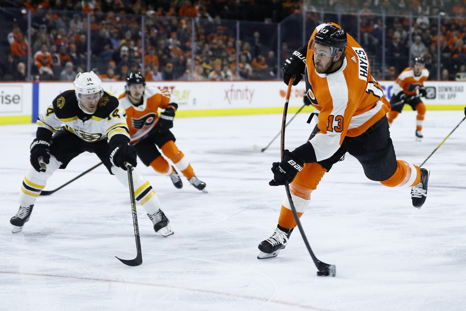 Philadelphia Flyers' Kevin Hayes, right, takes a shot past Boston Bruins' Chris Wagner during the second period of an NHL hockey game, Tuesday, March 10, 2020, in Philadelphia.