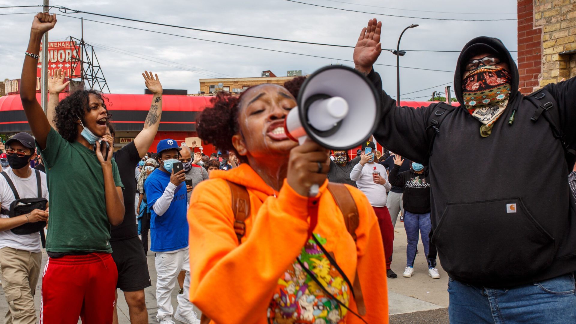 A young woman leads a group of protesters in chants outside the Minneapolis Police Third Precinct on Wednesday evening. The death of George Floyd, after video surfaced of an officer kneeling on his neck, has prompted protests nationwide -- nowhere more heated than in Minneapolis.