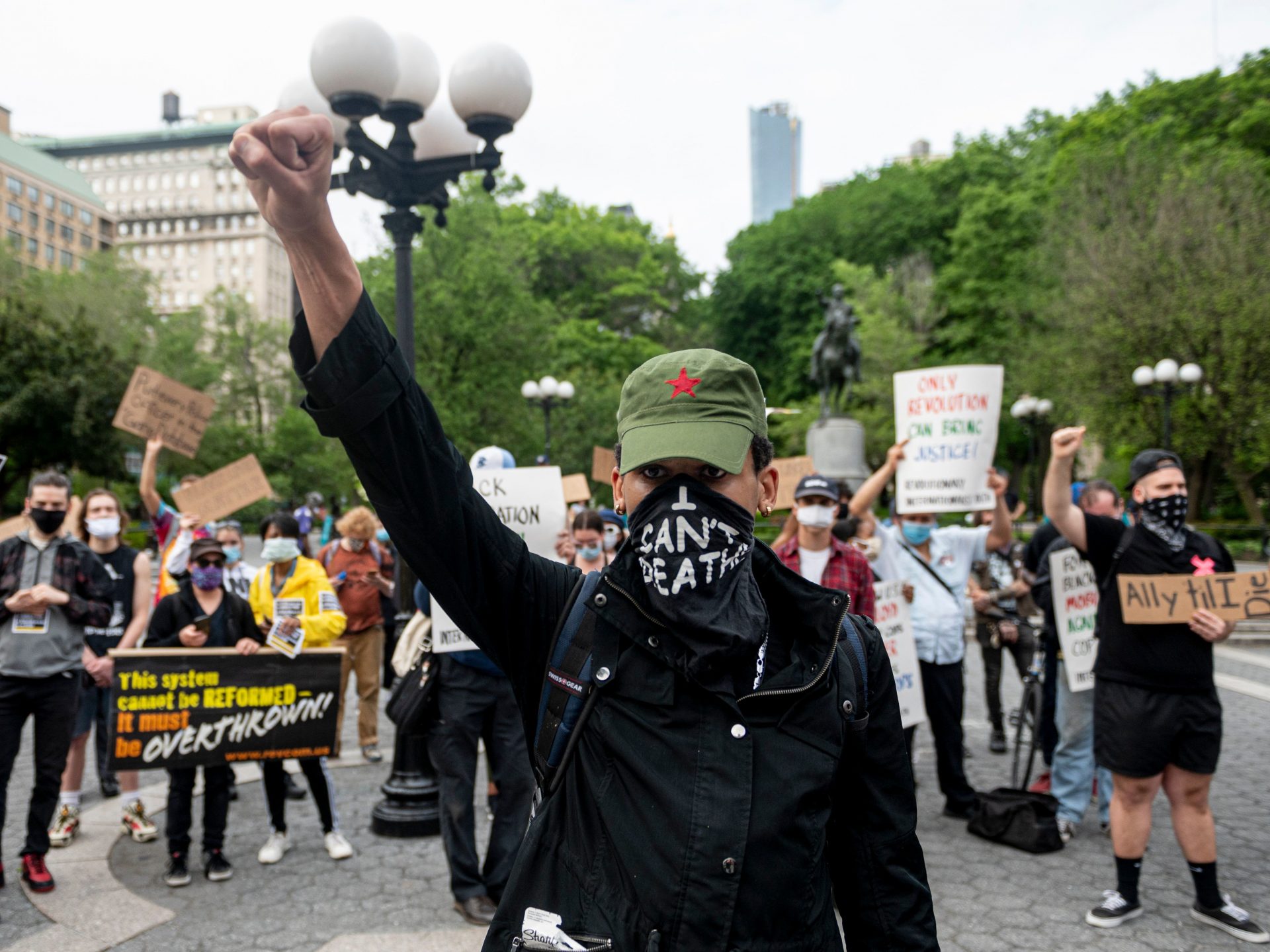 A protester raises a fist during a "Black Lives Matter" demonstration Thursday in New York City -- just one of a number of protests nationwide inspired by Floyd's death in Minneapolis.
