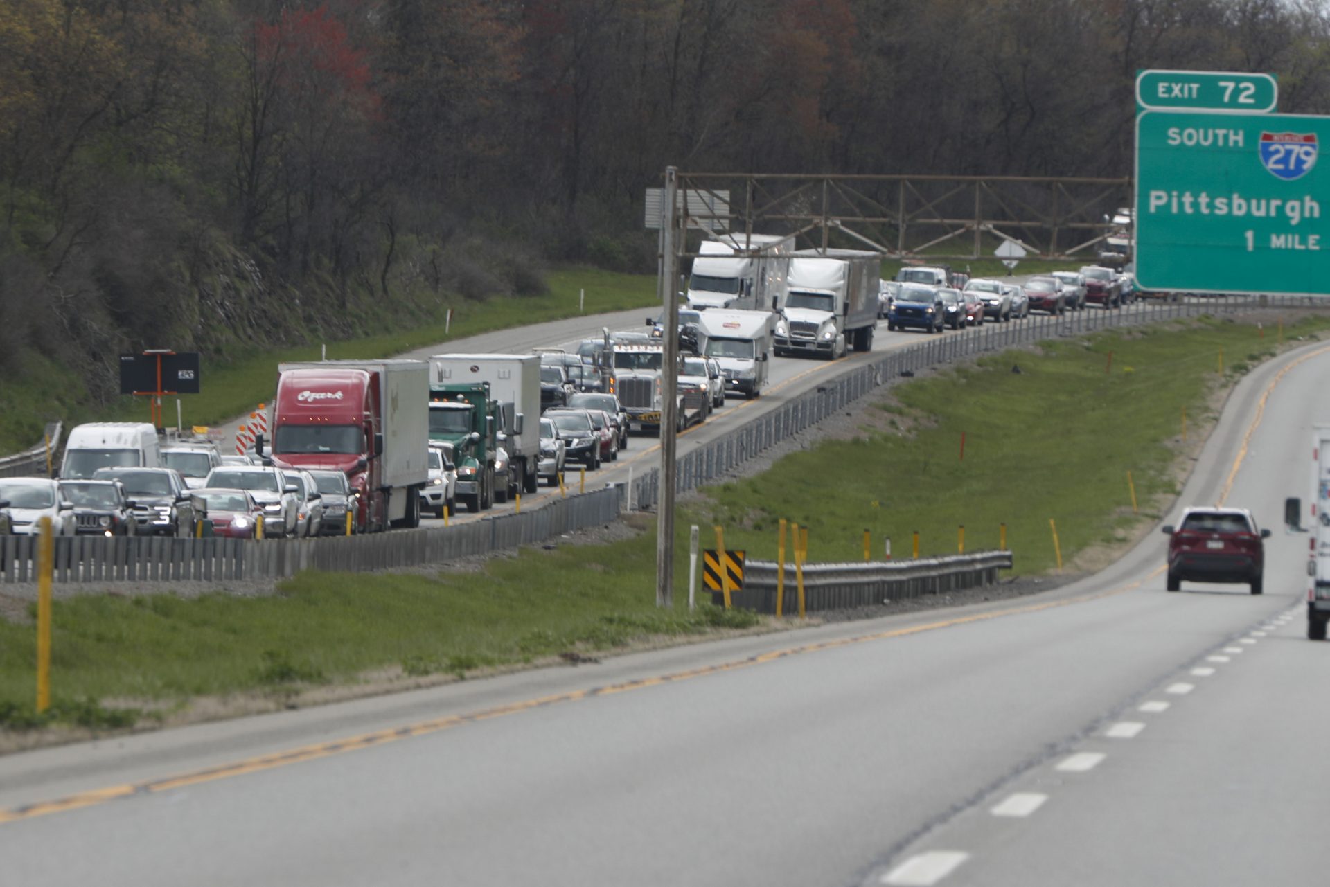 Traffic buildups return as paving and construction resume on Interstate 79, Friday, May 1, 2020, in Franklin Park, Pa. Road construction was halted in mid-March when the state ordered a stop to non-essential business to slow the spread of the new coronavirus.