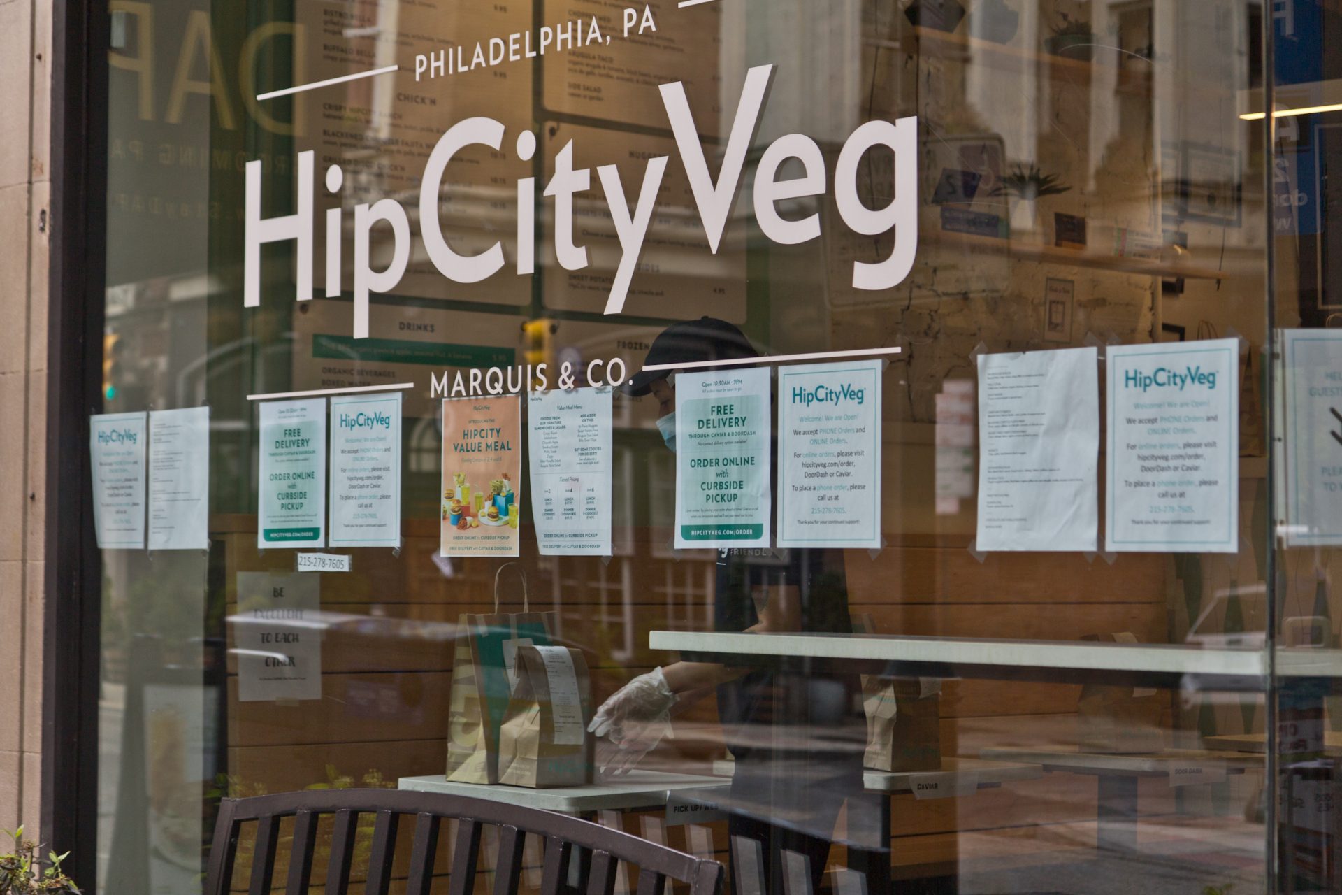 Hip City Veg employees prepare to-go orders in Center City.