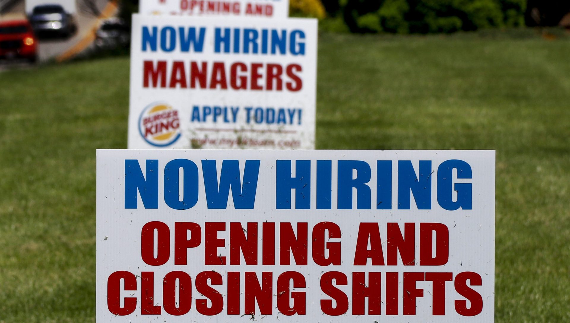 A row of signs advertising jobs are posted in front of a Burger King restaurant, Thursday, May 21, 2020, in Harmony, Pa. The number of Americans applying for unemployment benefits in the two months since the coronavirus took hold in the U.S. has swelled to nearly 39 million, the government reported Thursday, even as states from coast to coast gradually reopen their economies and let people go back to work.