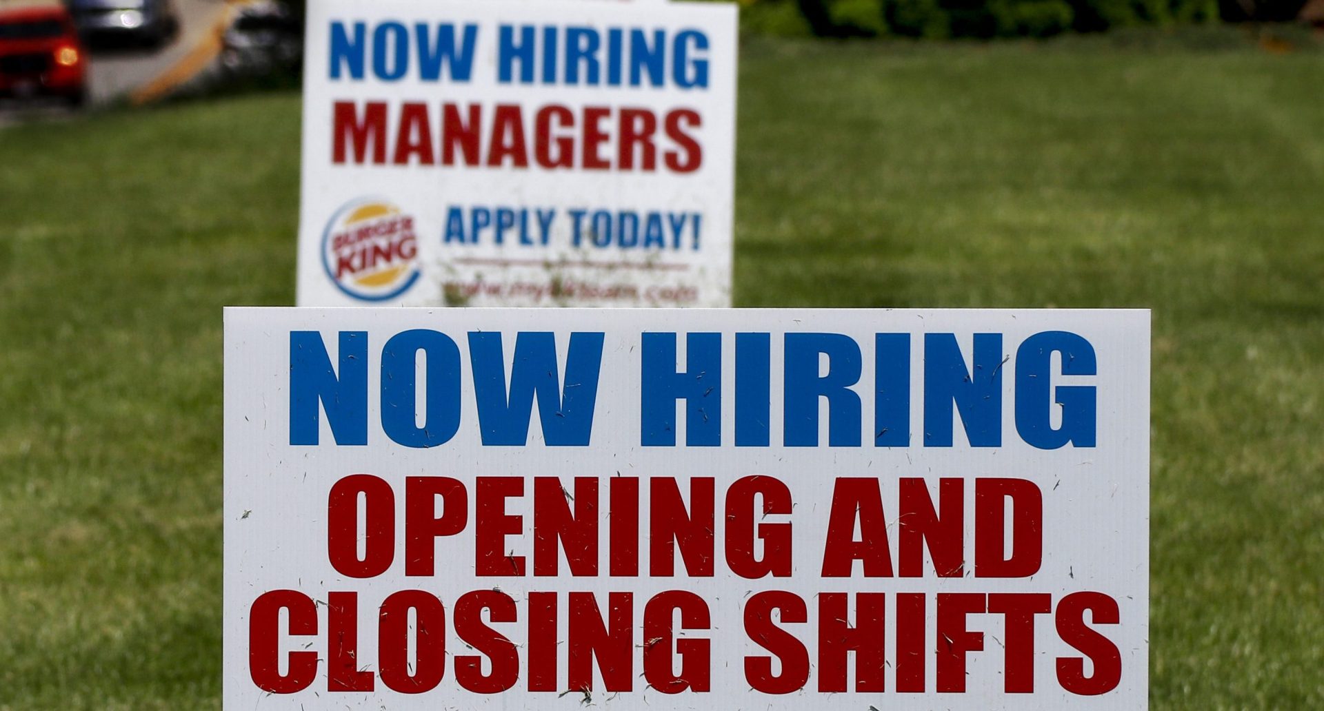 A row of signs advertising jobs are posted in front of a Burger King restaurant, Thursday, May 21, 2020, in Harmony, Pa. The number of Americans applying for unemployment benefits in the two months since the coronavirus took hold in the U.S. has swelled to nearly 39 million, the government reported Thursday, even as states from coast to coast gradually reopen their economies and let people go back to work. 