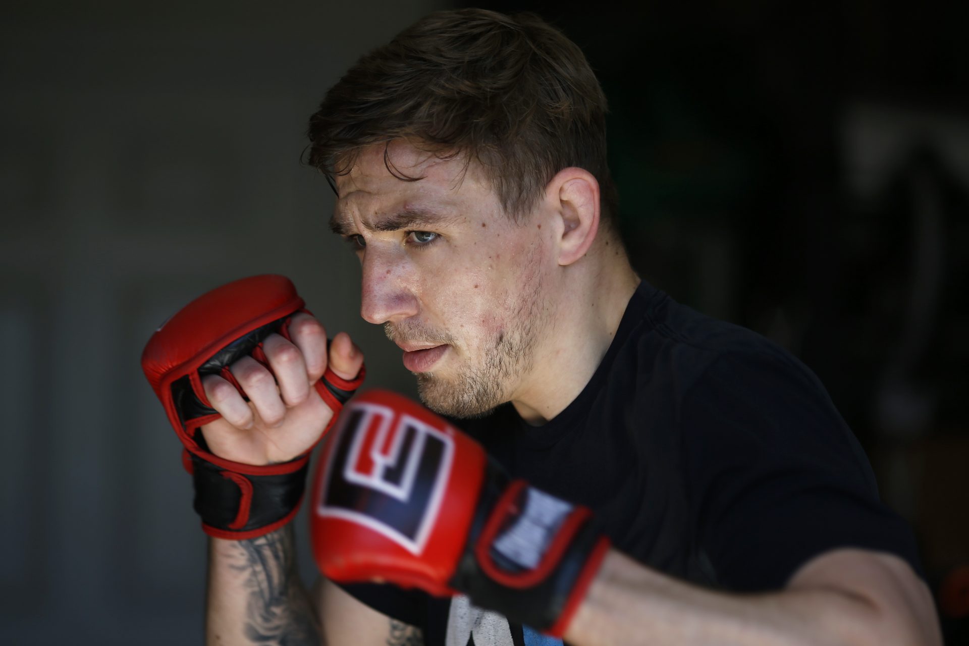 Fighter Kyle Daukaus trains in his garage, Saturday, May 2, 2020, in Philadelphia. Daukaus, a rising star in the regional MMA promotion Cage Fury Fighting Championships, is still chasing his dream of getting the call to fight for UFC despite the coronavirus pandemic.
