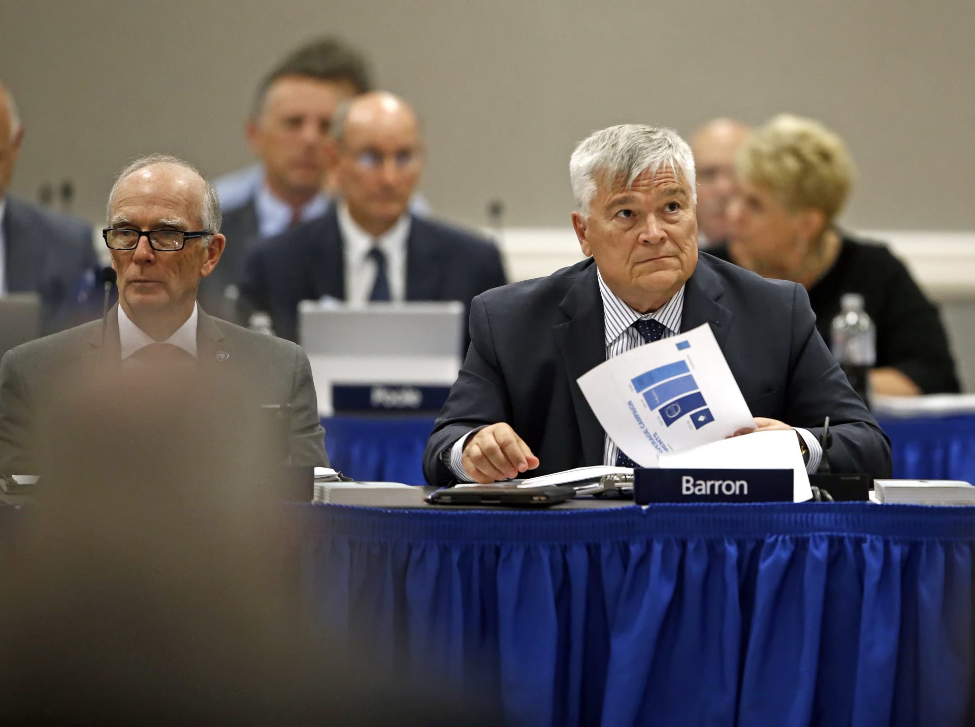 FILE PHOTO: Penn State President Eric J. Barron, right, listens during a Penn State University Board of Trustees meeting on the campus of Penn State Harrisburg in Middletown, Pa., Friday, July 21, 2017.