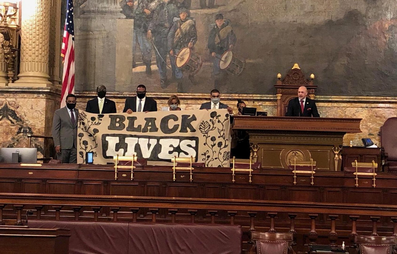 Five Pa. House Democrats hold a Black Lives Matter protest while state Rep. Christopher Rabb (D-Philadelphia) delivers remarks from the Speaker's rostrum on Monday, June 8, 2020. Black lawmakers prevented the regular session from beginning as scheduled in order to protest the killing of George Floyd and to call on the GOP majority to take up a slate of police reform bills.