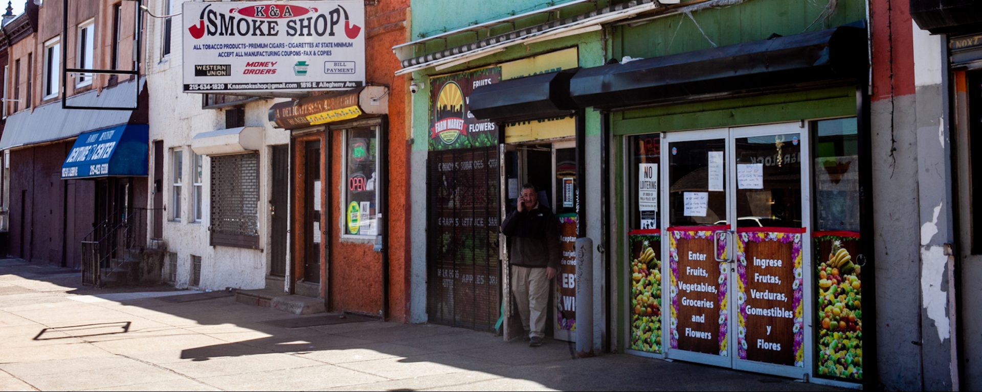 Abdelmgeed Muhammad Elgamel stands outside of his produce market on Allegheny Avenue in Kensington Tuesday.