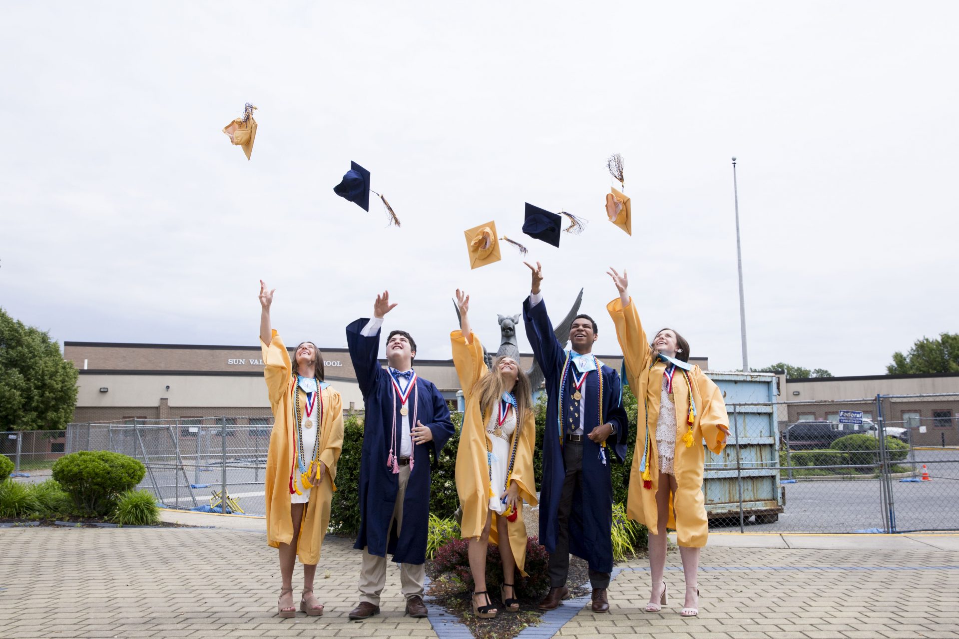 Bryson Eldrige (second to right), Sun Valley senior class president, throws his graduation cap with Sun Valley class officers (from left) Shay Buck, Dominick Marano, Sophia Belgirono, and Holly Dan after the class put together a virtual commencement ceremony on June 2, 2020.