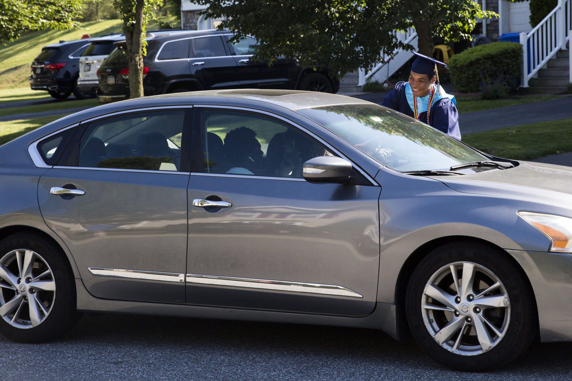 Bryson Eldridge greets a guest at his "drive by" graduation party on June 9, 2020. COVID-19 forced the Eldridge family to alter their graduation party plans.