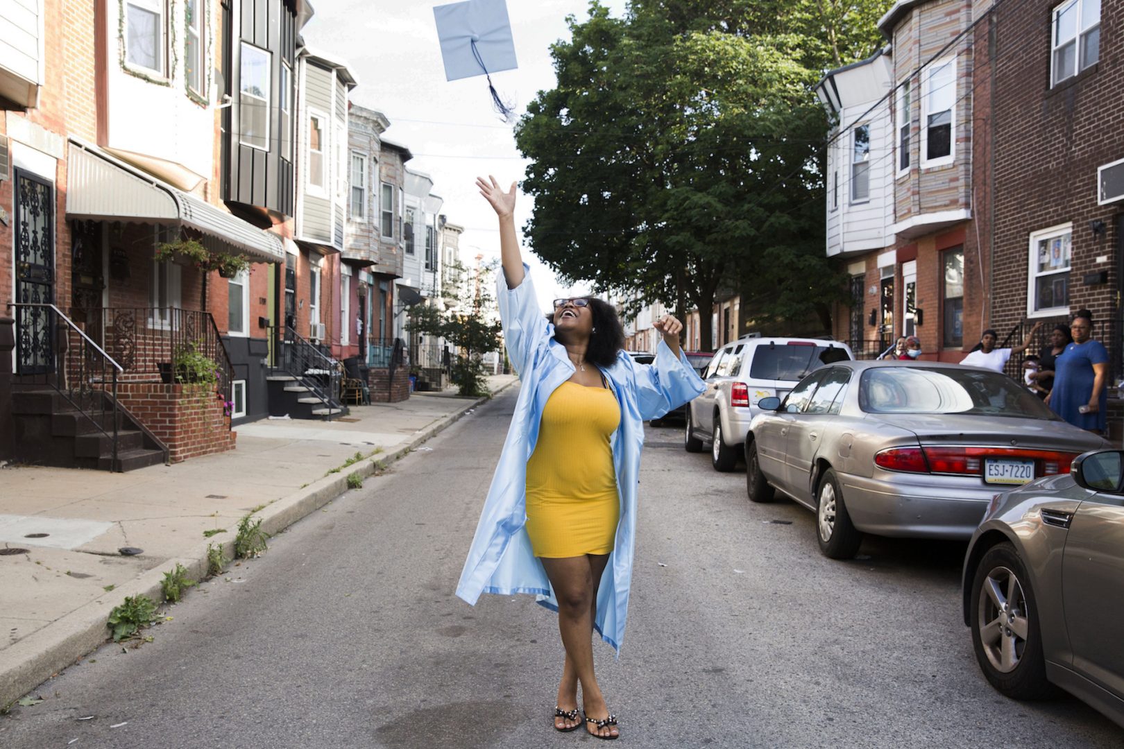 Aliah Harris throw her graduation cap in celebration following her high school's virtual graduation ceremony on June 10, 2020.