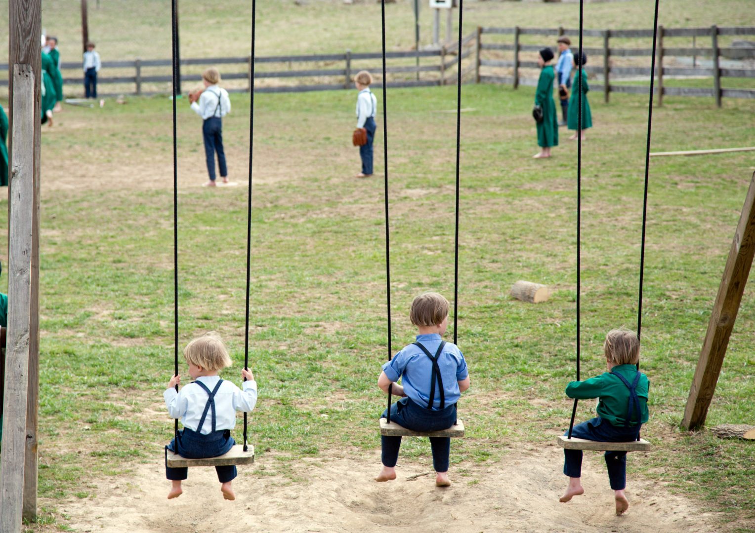 FILE PHOTO: Amish children play in the field outside a schoolhouse in Bergholz, Ohio on April 9, 2013.