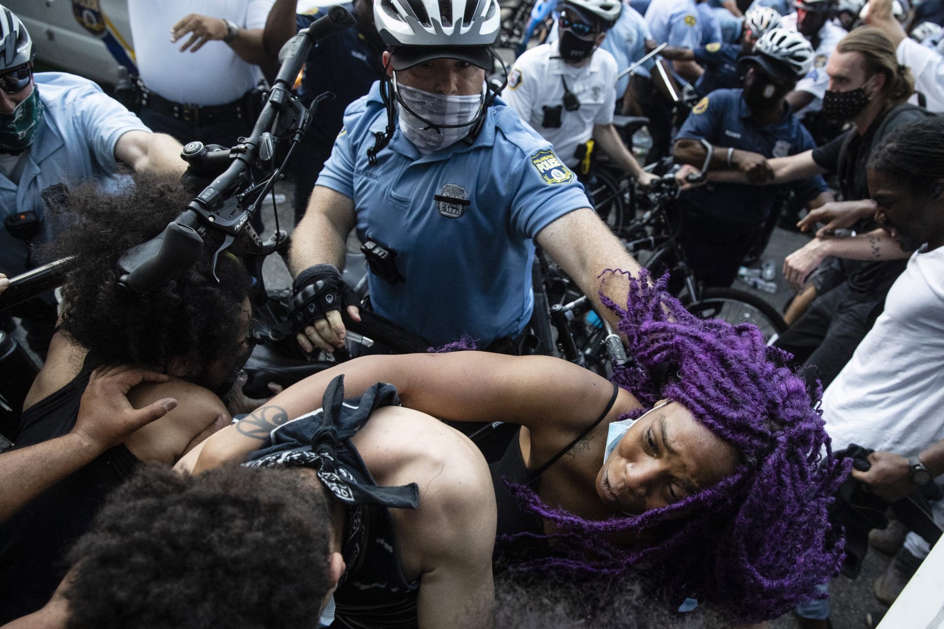 Police and protesters clash Saturday, May 30, 2020, in Philadelphia, during a demonstration over the death of George Floyd, a black man who was in police custody in Minneapolis. Floyd died after being restrained by Minneapolis police officers on Memorial Day.