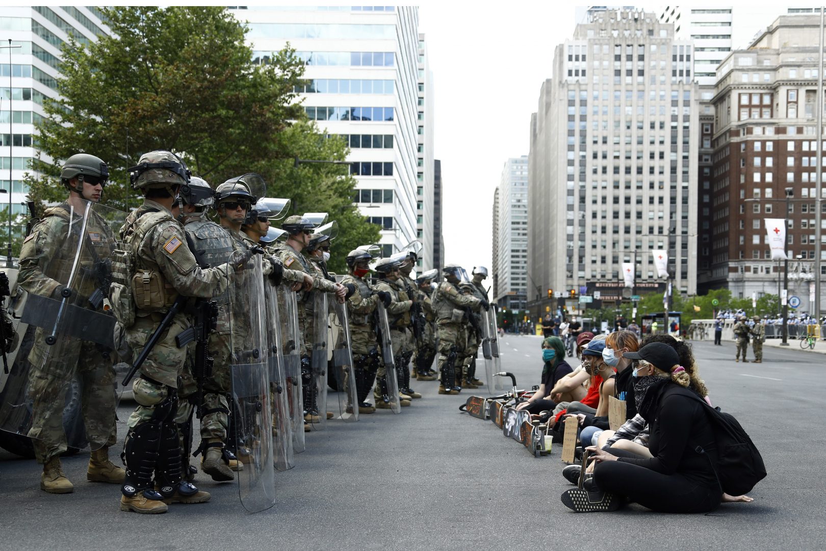 Protesters rally in front of Pennsylvania National Guard soldiers, Monday, June 1, 2020, in Philadelphia, over the death of George Floyd, a black man who was in police custody in Minneapolis. Floyd died after being restrained by Minneapolis police officers on May 25. 