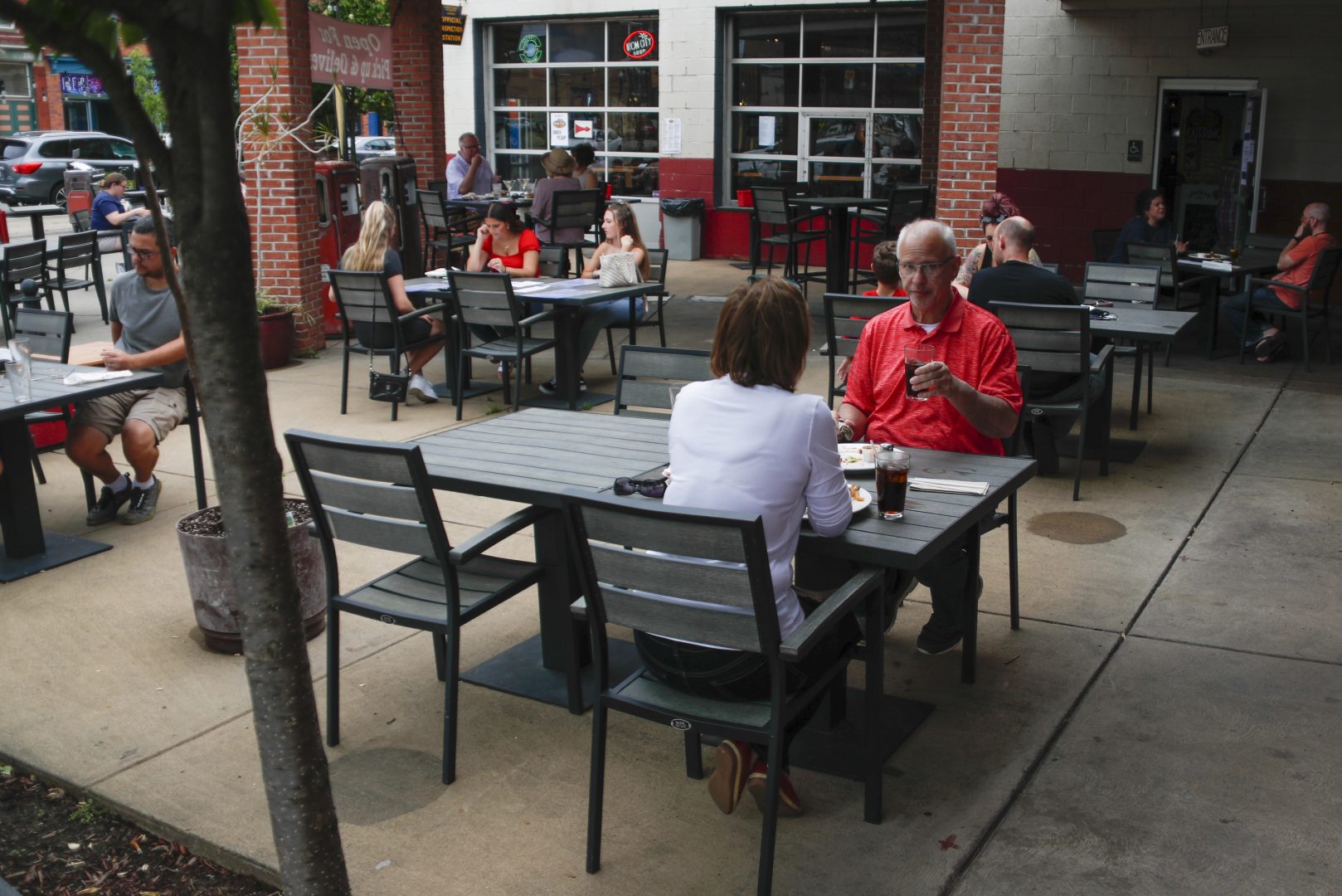 People take advantage of newly lowered COVID-19 protective restrictions in most of southwest Pennsylvania and have lunch outside on the re-opening day for seated patrons at a diner on Pittsburgh's Southside, Friday, June 5, 2020.