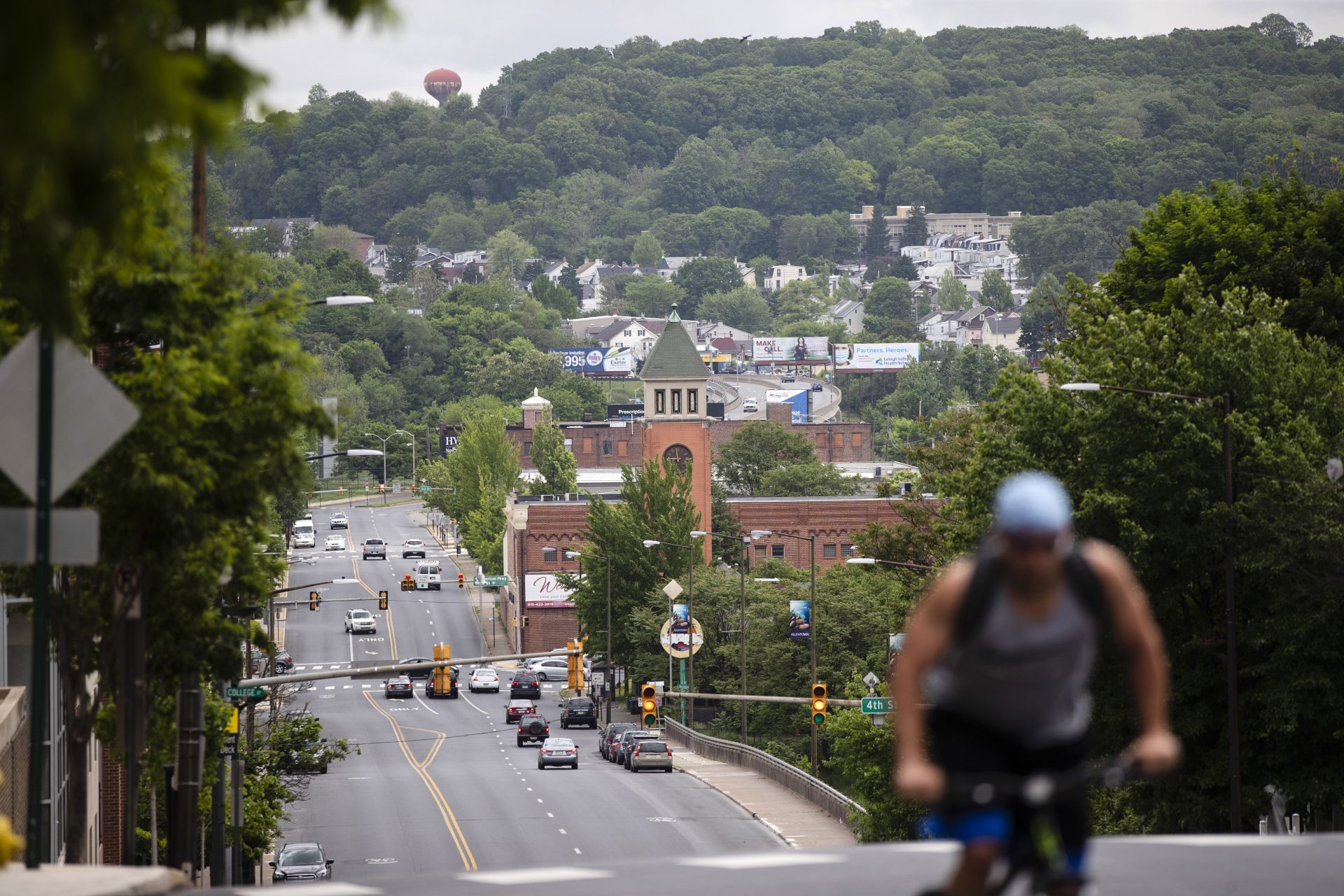 A cyclist pedals up a hill in Allentown, Pa., Friday, May 29, 2020. Allentown predicts a budget deficit of over $10 million, a number officials say could go higher if the economy doesn’t rebound quickly. 