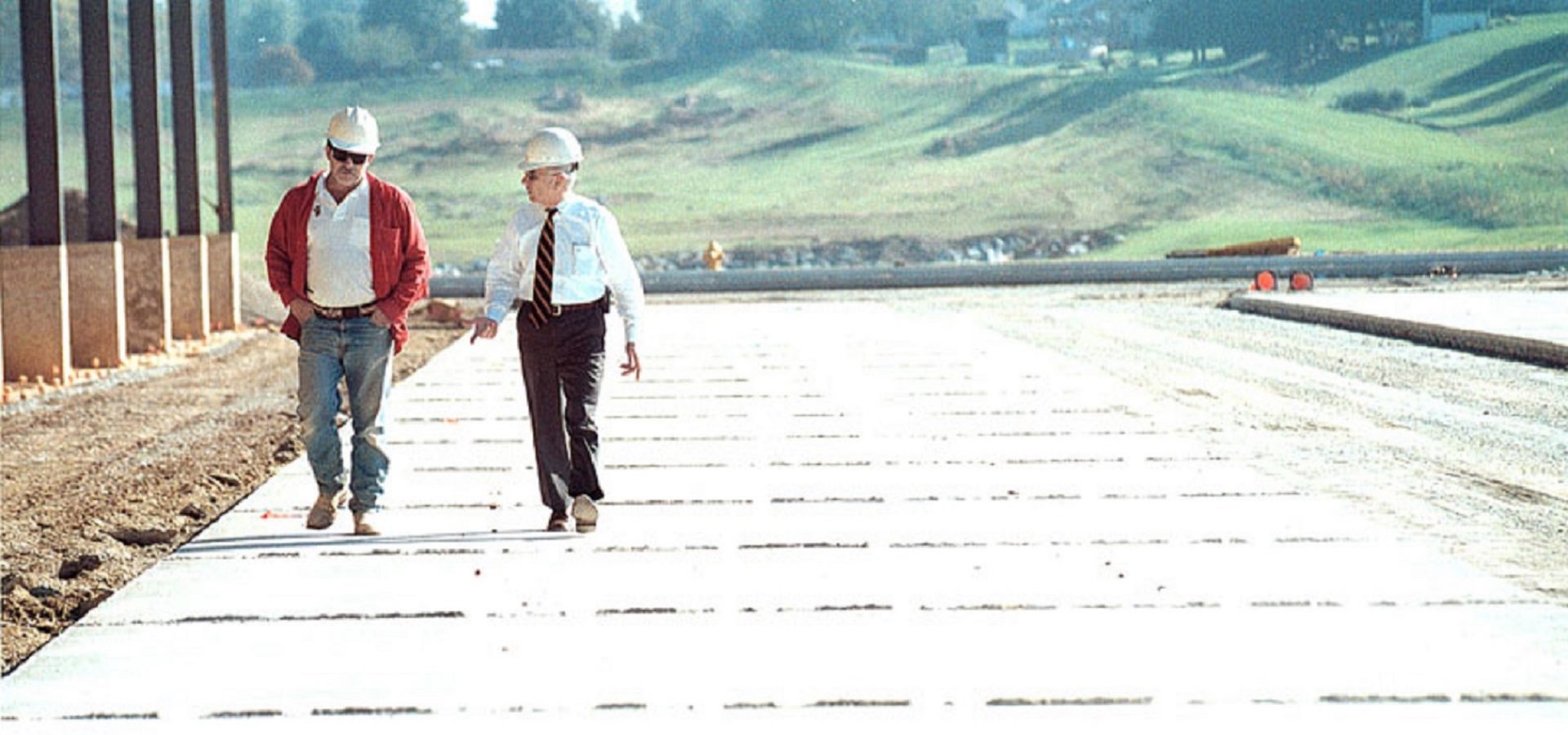 In this submitted photograph, Robert Kinsley, right, walks with a construction site manager. 