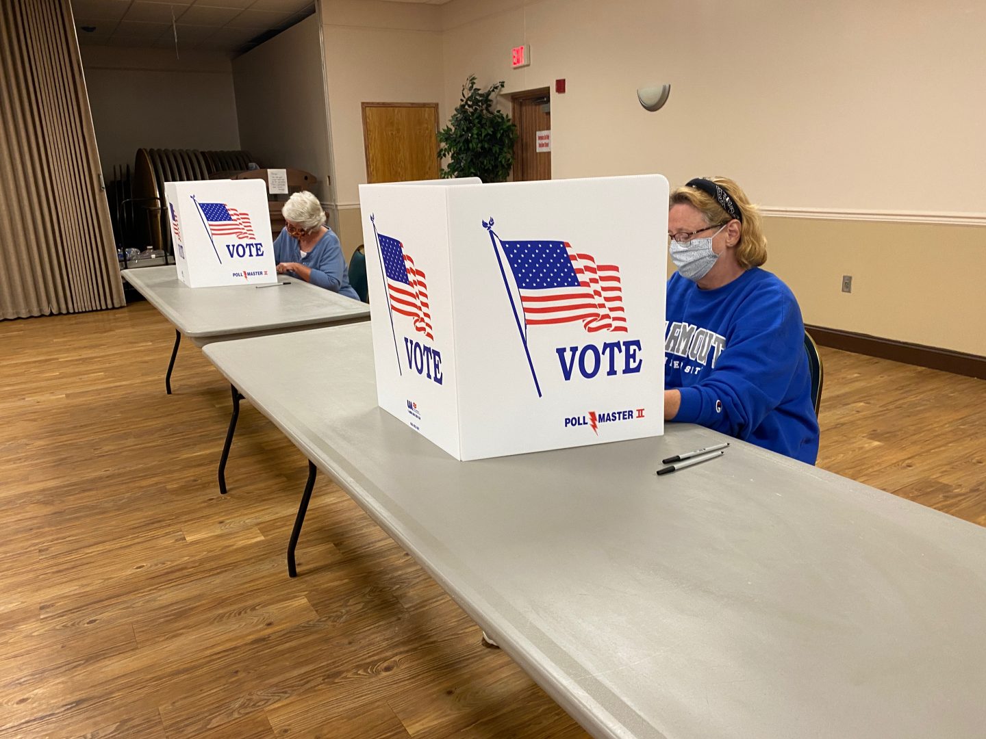 Two voters fill out ballots at the 8th precinct in Swatara Township, Dauphin County, on June 2, 2020. Desks were separated by more space than usual to accommodate social distancing guidelines for coronavirus.