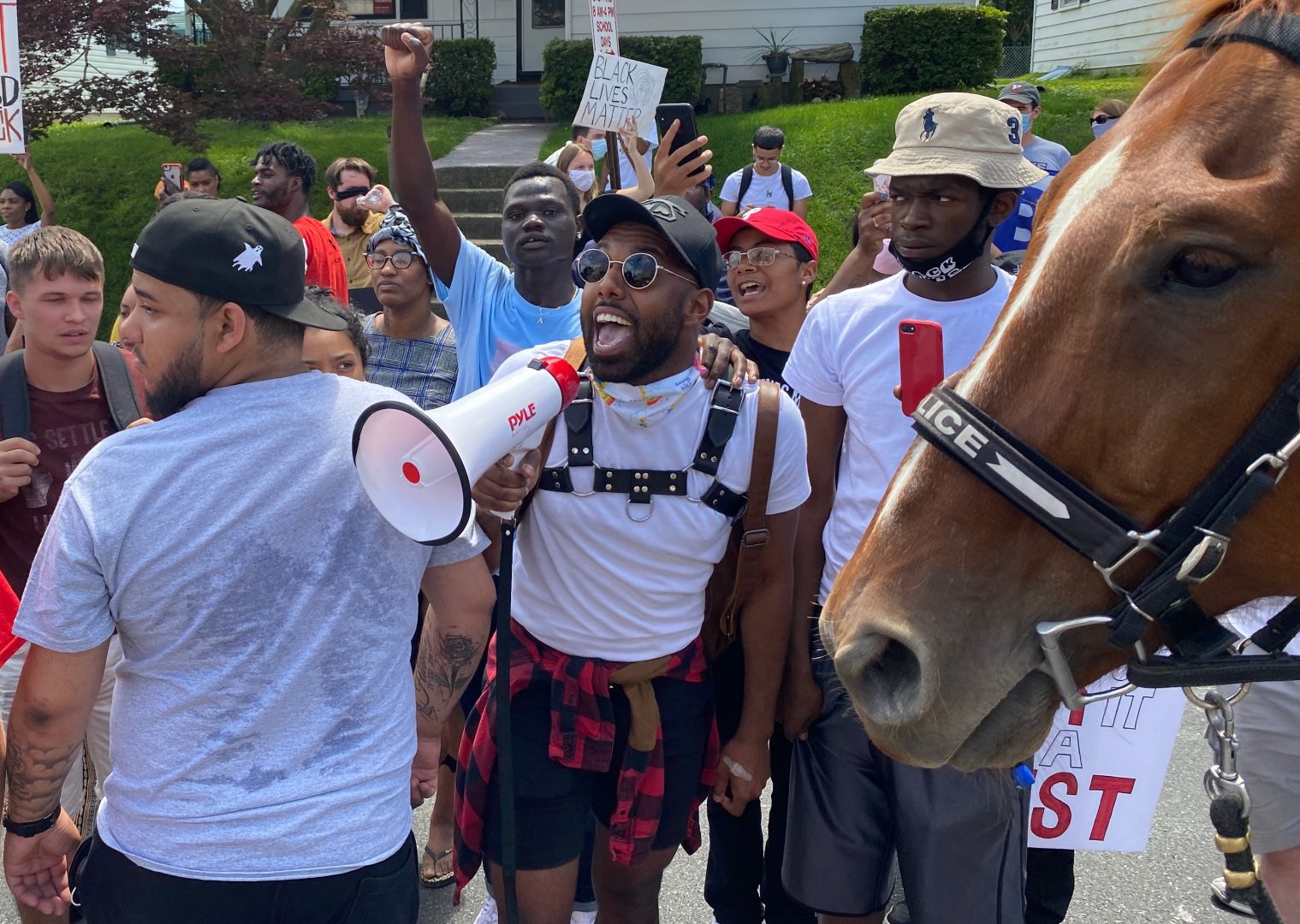 Kareem Anthony speaks into a bullhorn during a protest outside the Lancaster Recreation Center ahead of a planned visit by Democratic presidential candidate Joe Biden on Thursday, June 25, 2020.