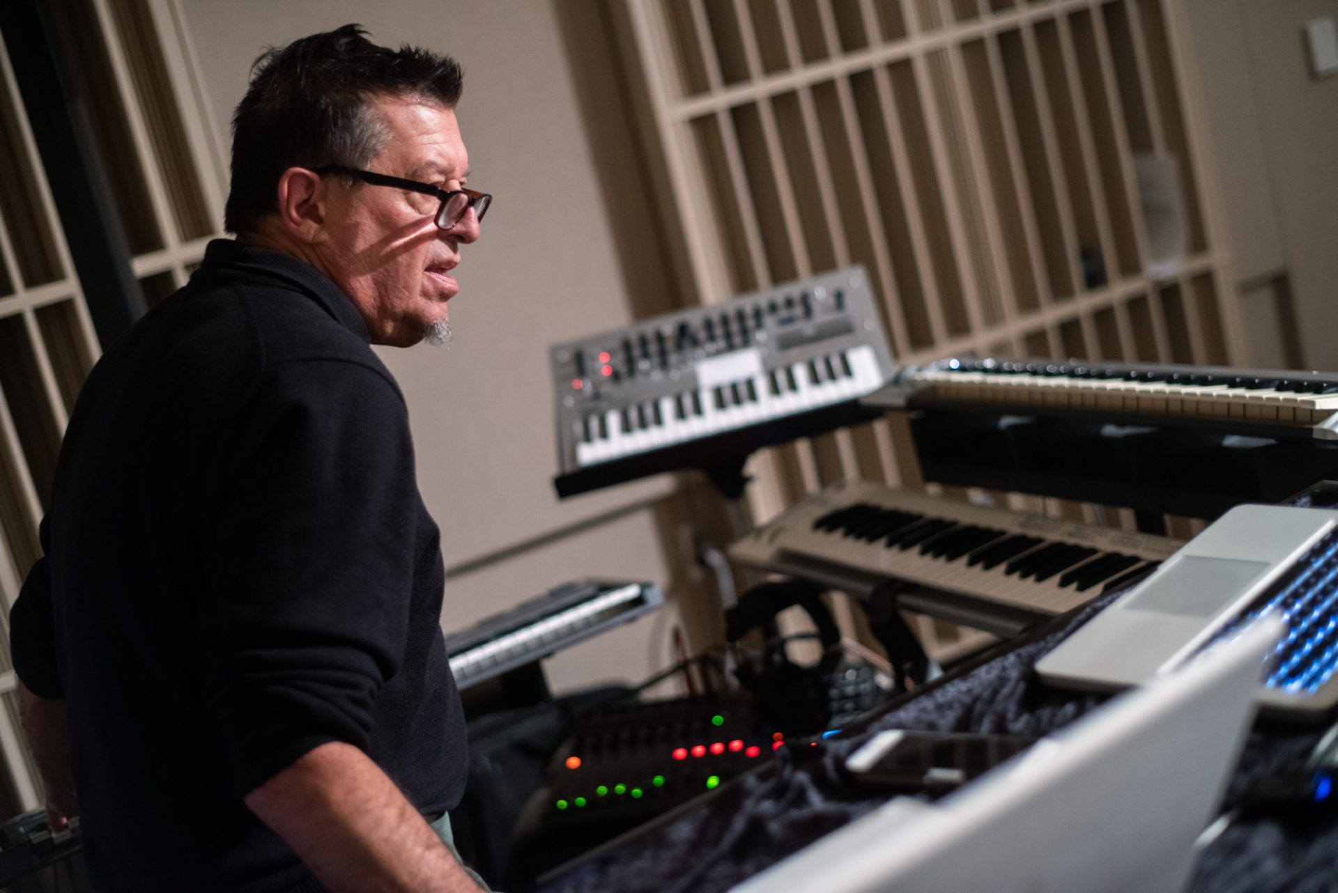 Ralph Diekemper playing keyboard and piano in the studio.