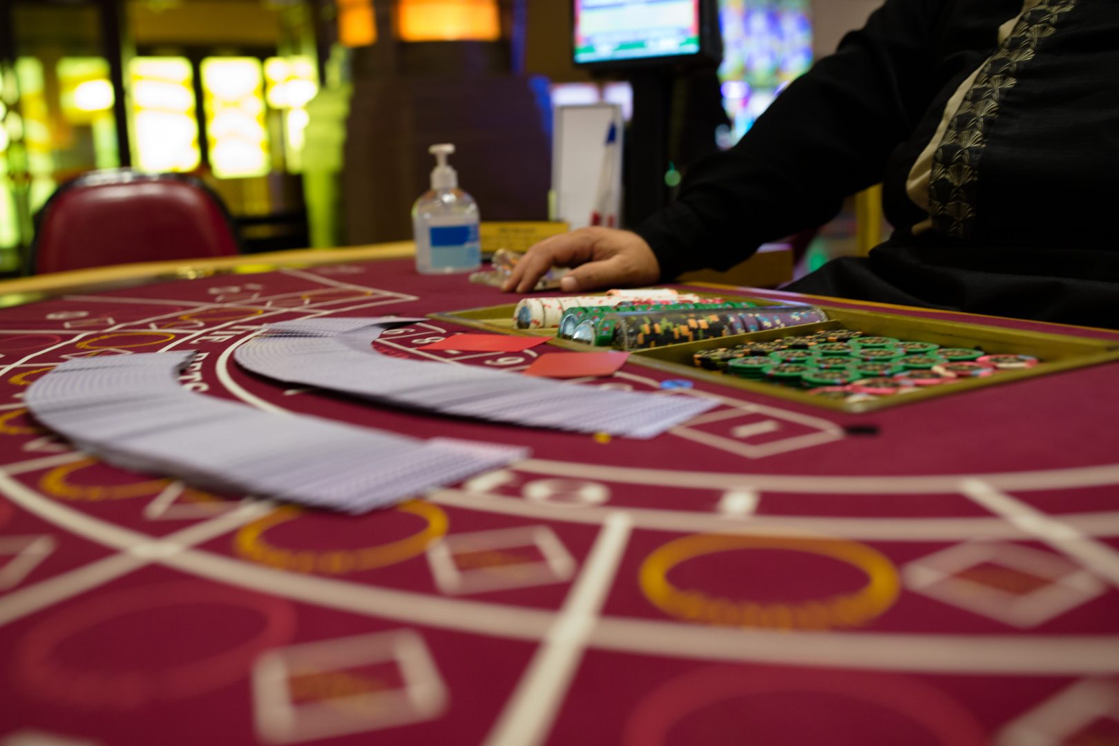 A dealer sits at a blackjack table with hand sanitizer at Hollywood Casino in Grantville on Friday, June 19, 2020.