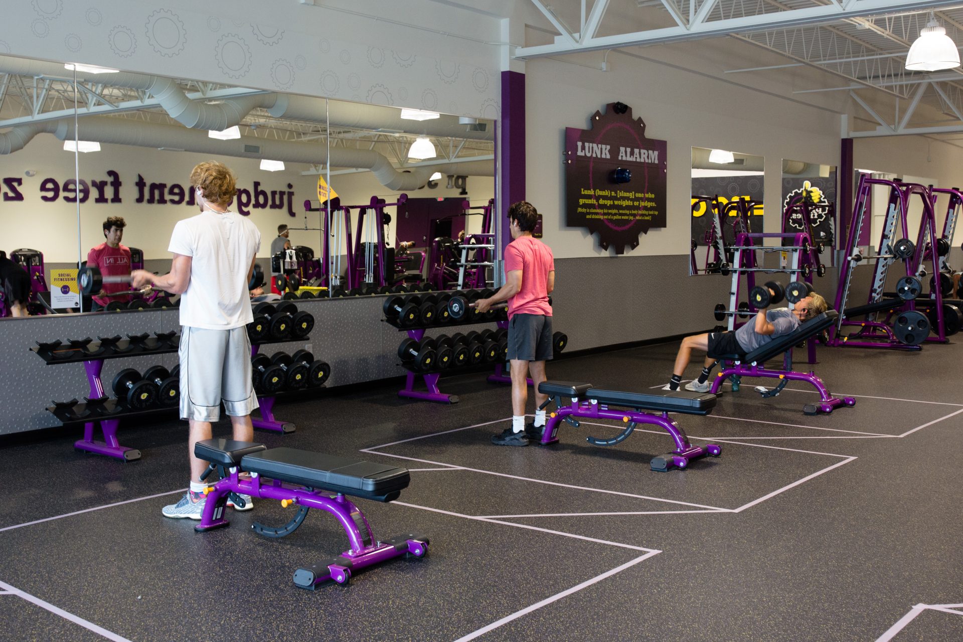 People lift weights in marked areas at the Planet Fitness along Allentown Boulevard in Harrisburg on June 19, 2020. As the gym reopened to customers, it marked off dedicated spaces to maintain distance between patrons.