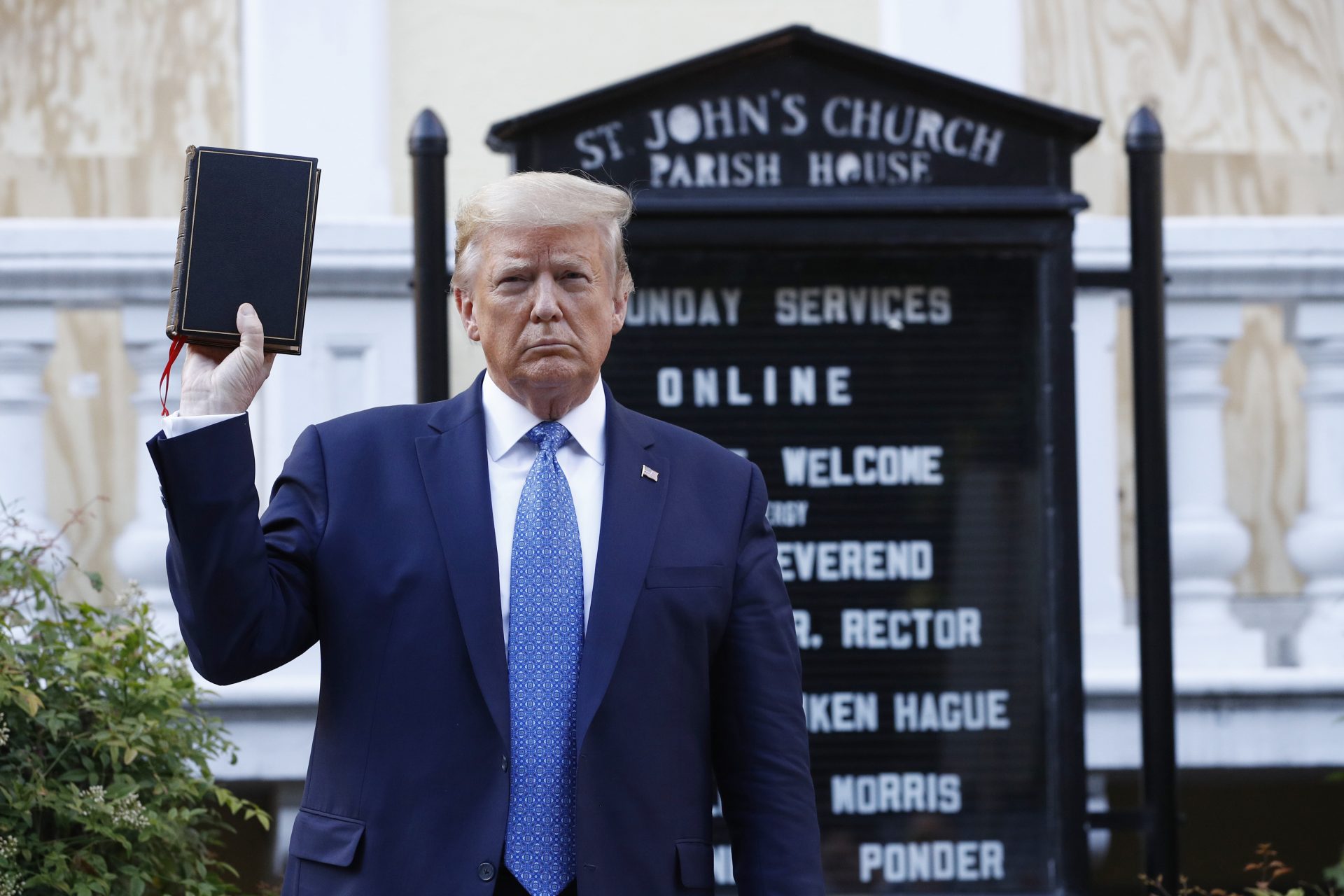 President Donald Trump holds a Bible as he visits outside St. John's Church across Lafayette Park from the White House Monday, June 1, 2020, in Washington. Park of the church was set on fire during protests on Sunday night.