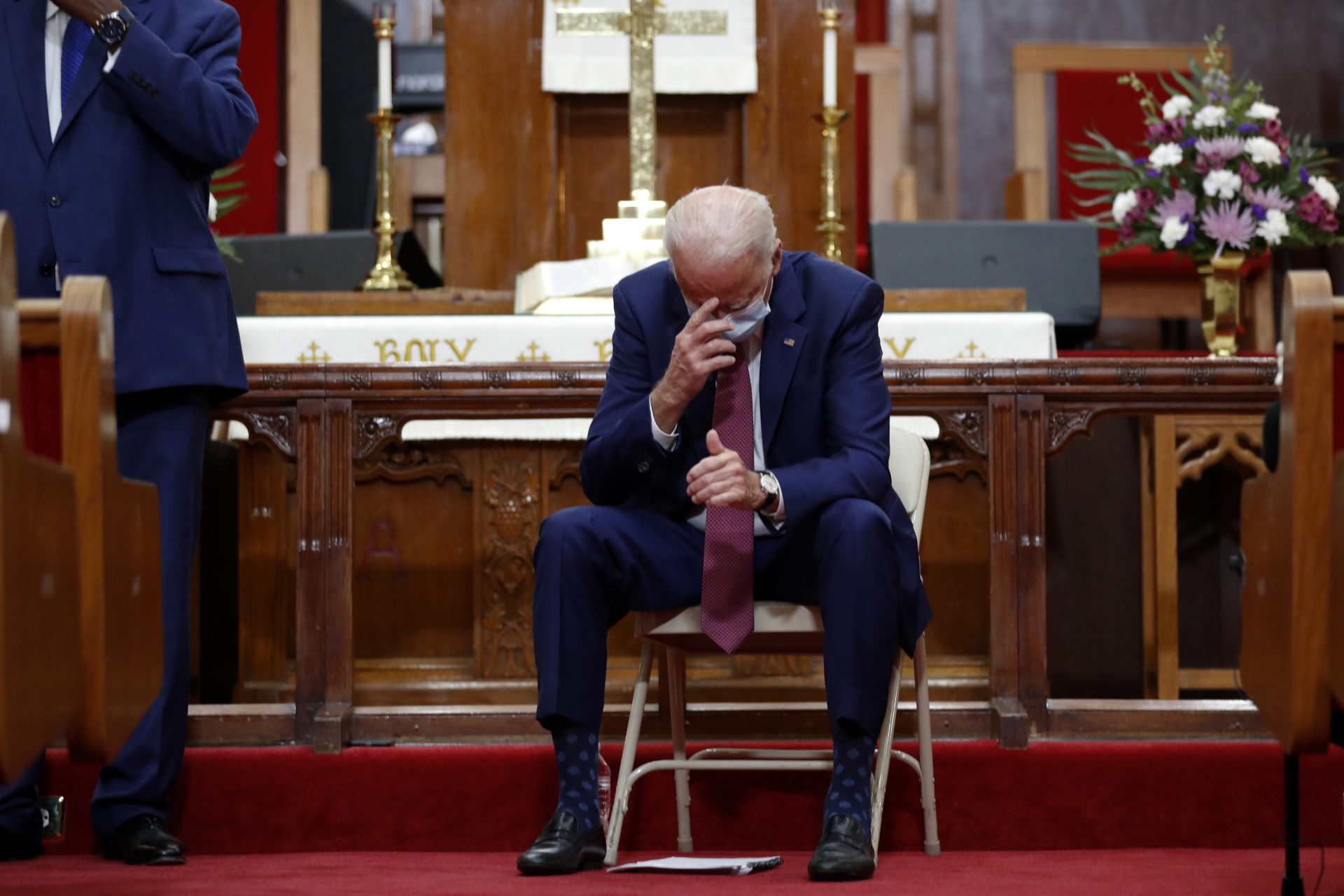 Democratic presidential candidate, former Vice President Joe Biden bows his head and prays as he visits Bethel AME Church in Wilmington, Del., Monday, June 1, 2020