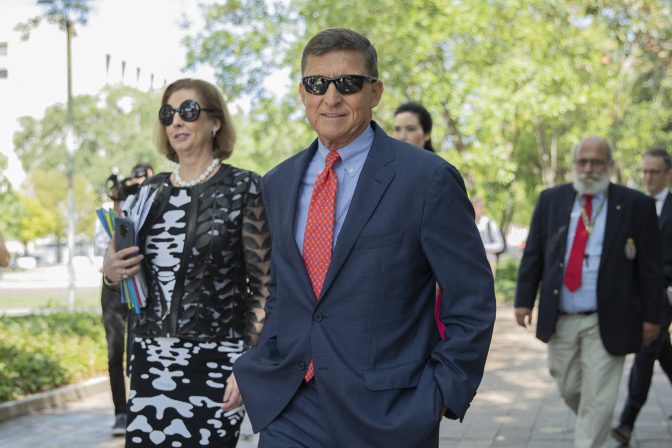 Michael Flynn, President Donald Trump's former national security adviser, leaves the federal court with his lawyer Sidney Powell, left, following a status conference with Judge Emmet Sullivan, in Washington, Tuesday, Sept. 10, 2019.