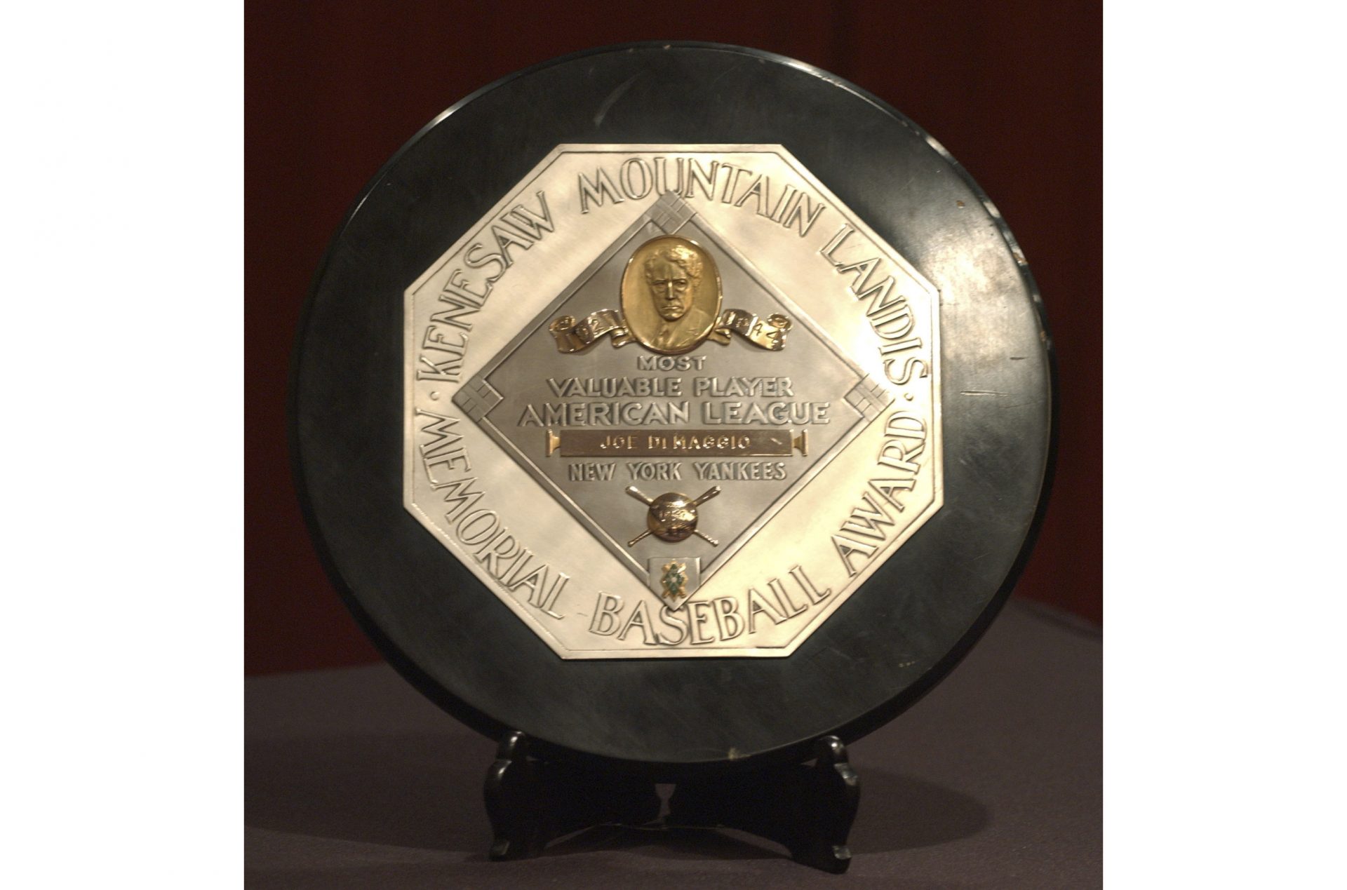 FILE - In this Jan. 22, 2006, file photo,a Joe DiMaggio 1947 MVP Award Plaque is displayed at a news conference in New York. The plaque features the name and image of Kenesaw Mountain Landis.