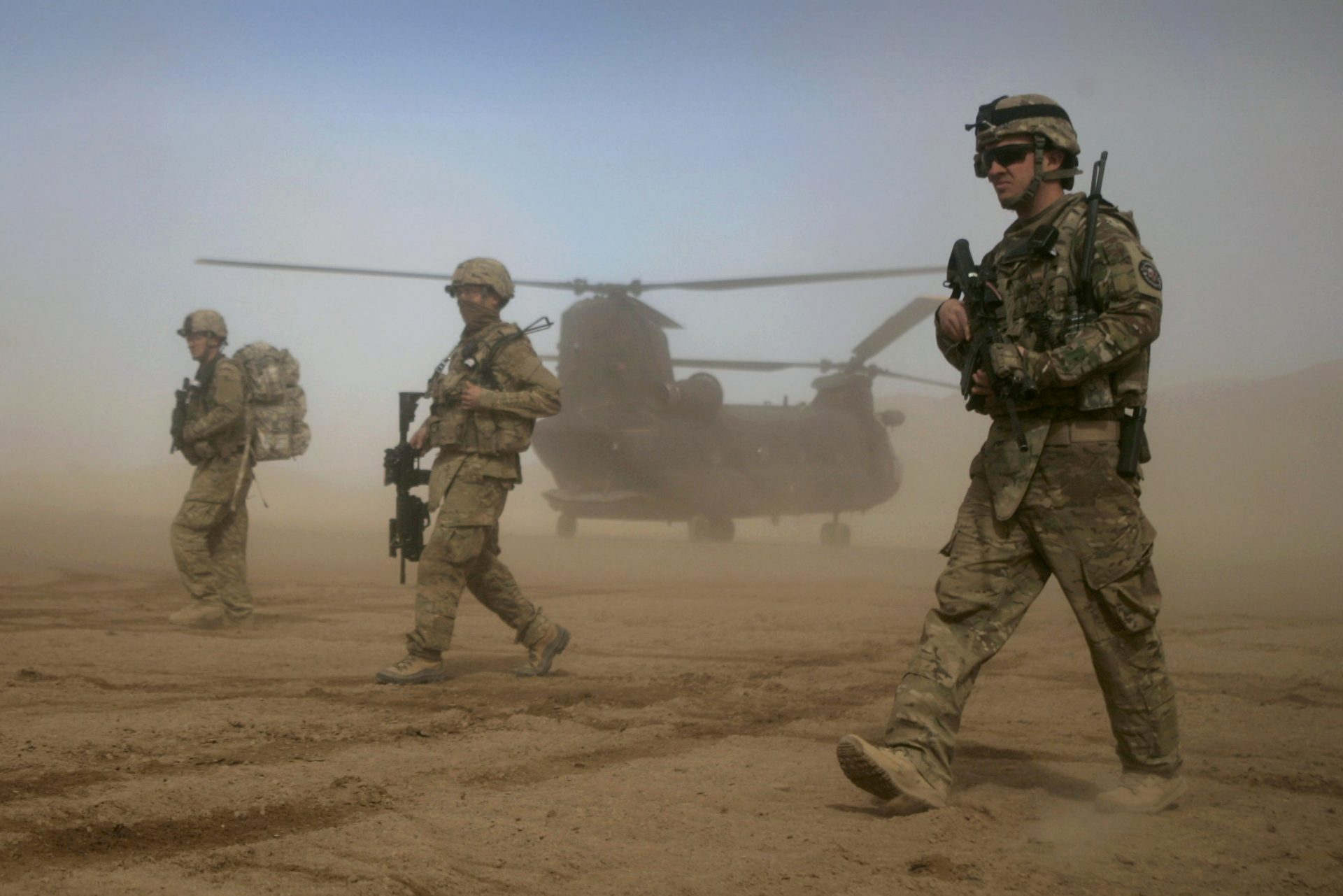 E - In this Saturday, Jan. 28, 2012 file photo, U.S. soldiers, part of the NATO- led International Security Assistance Force (ISAF) walk west of Kabul, Afghanistan.