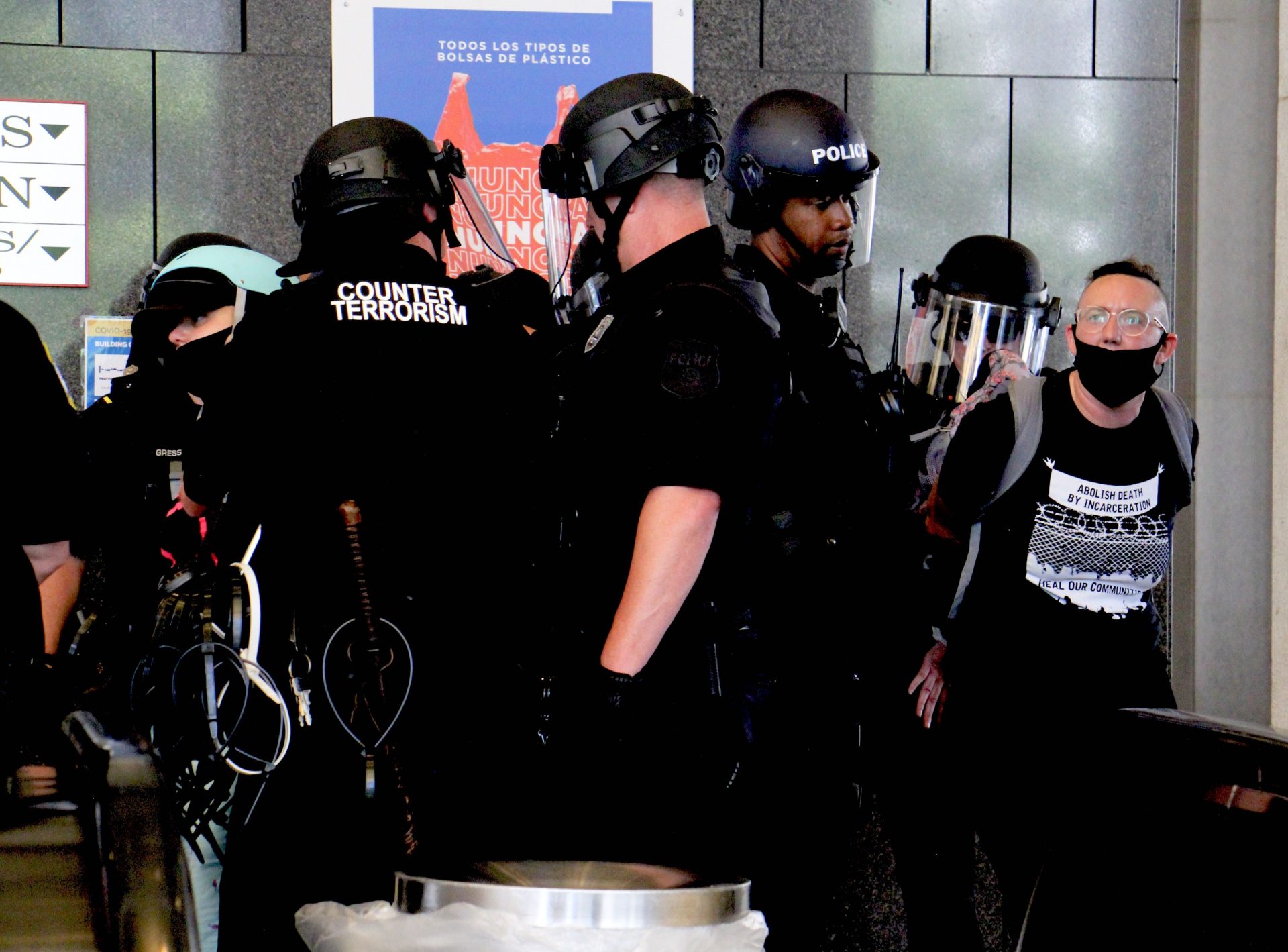 Philadelphia police arrest protesters inside the Municipal Services Building. (Emma Lee/WHYY)