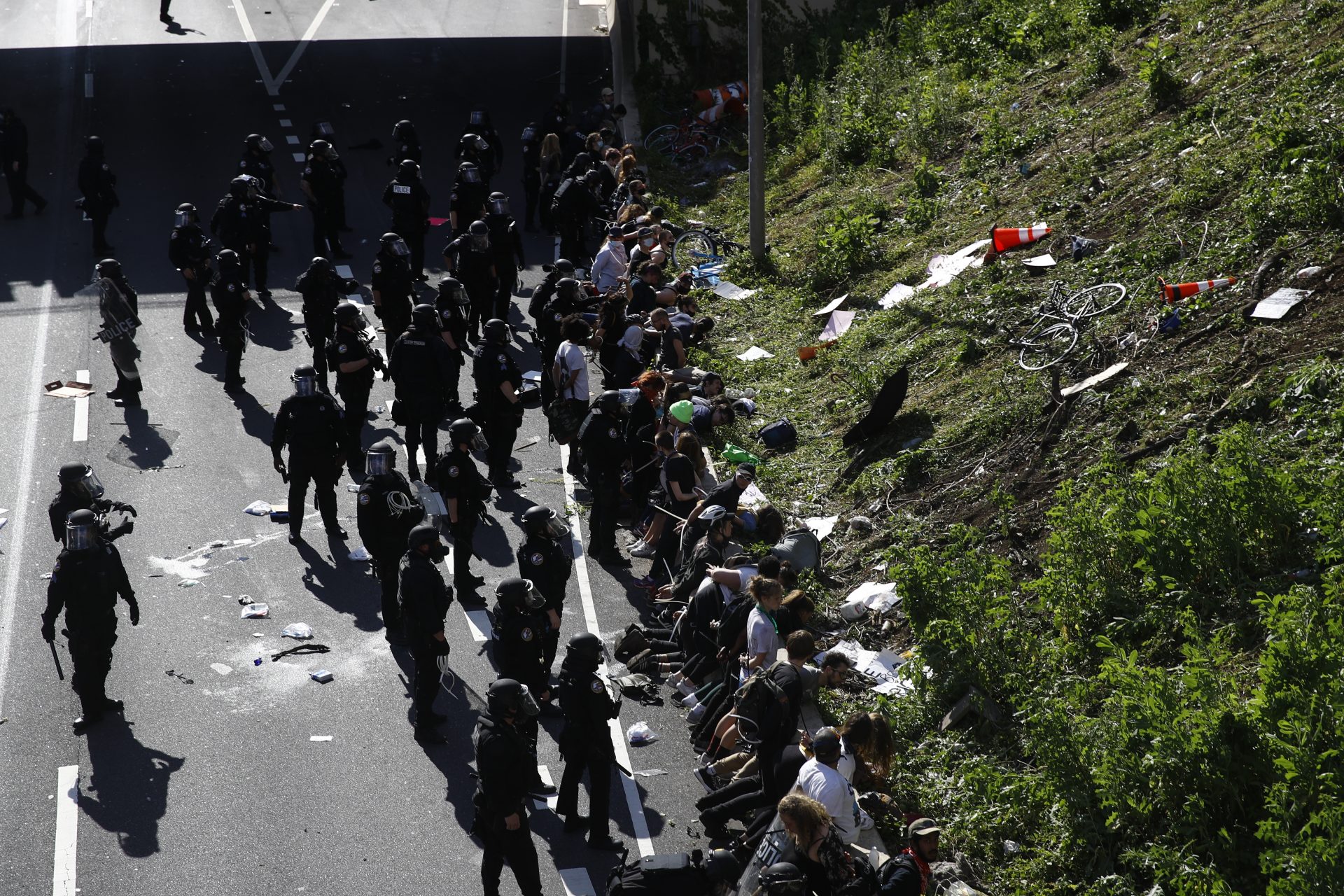 Police detain protesters in the aftermath of a march calling for justice over the death of George Floyd on Interstate 676 in Philadelphia, Monday, June 1, 2020. Floyd died after being restrained by Minneapolis police officers on May 25.