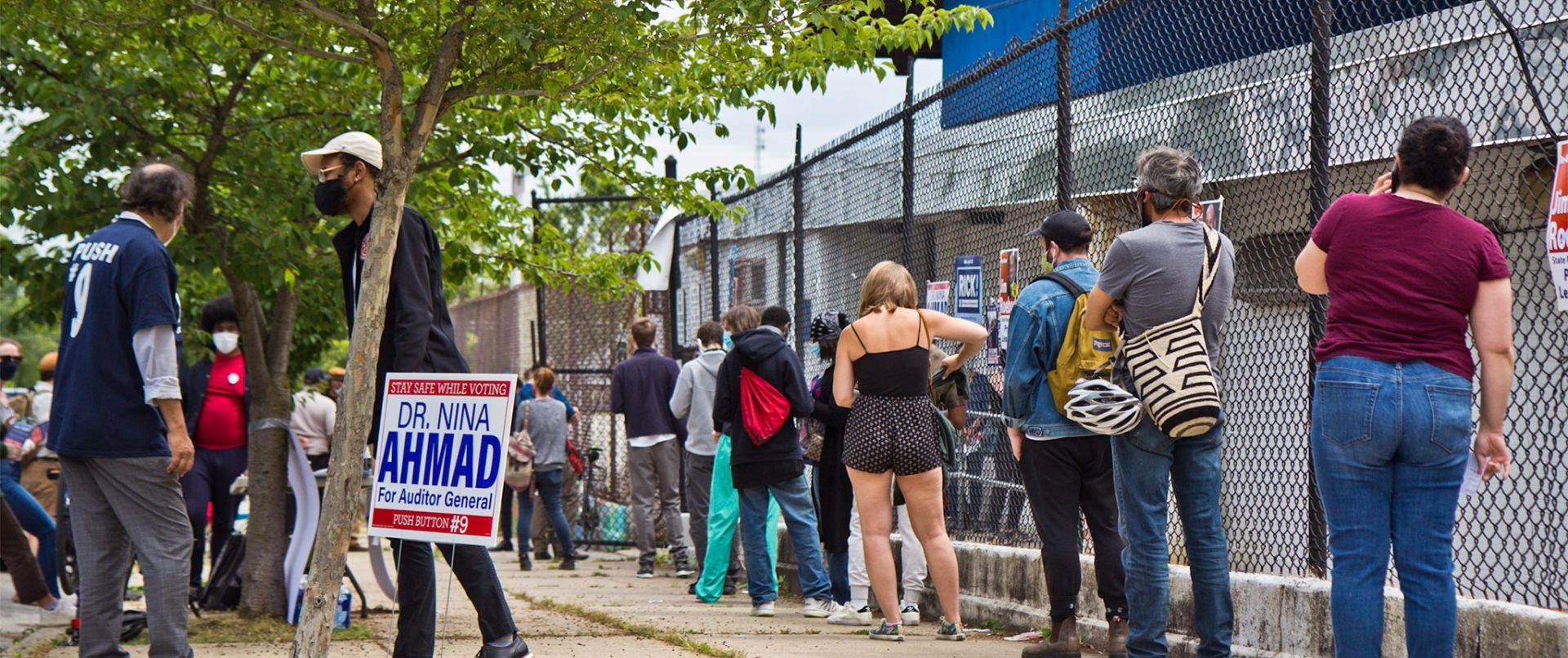 Voters wait in a socially distanced line outside their polling place in Philadelphia.