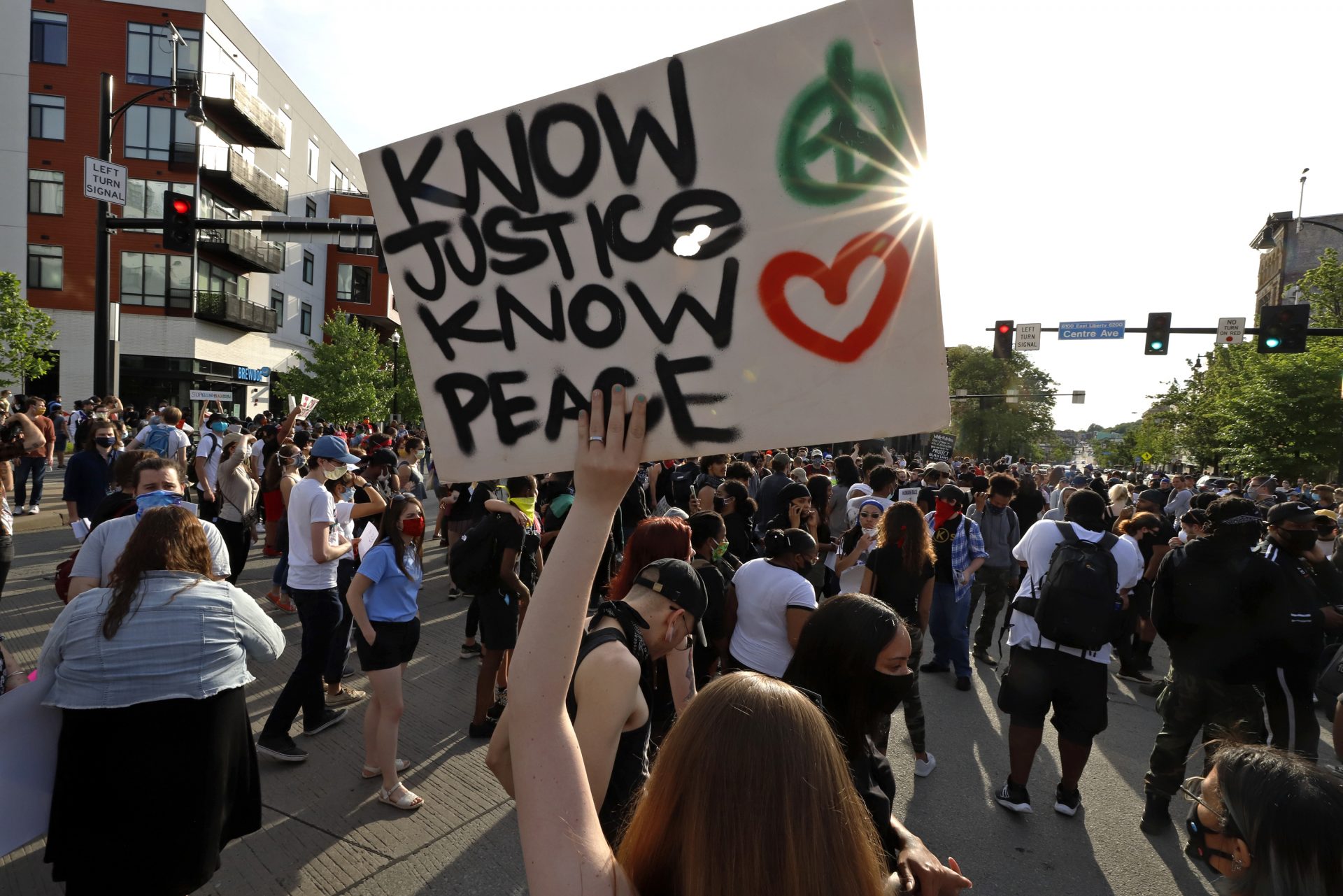 A group gathers, blocking an intersection in the East Liberty neighborhood of Pittsburgh on Monday, June 1, 2020 protesting the death of George Floyd, who died after being restrained by Minneapolis police officers on Memorial Day, May 25