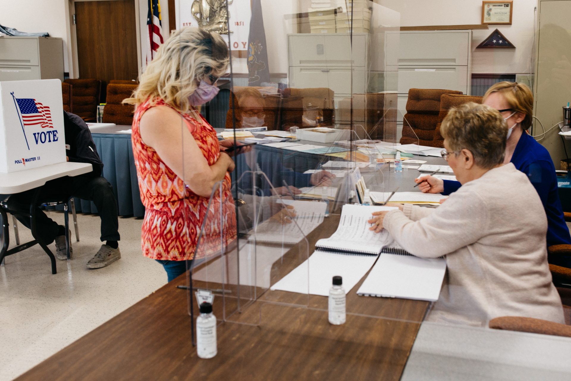A voter checks in at the Mount Joy Borough Municipal Office on June 2, 2020. Many polling places were equipped with plexiglass screens to minimize the chance of spreading coronavirus between poll workers and voters.