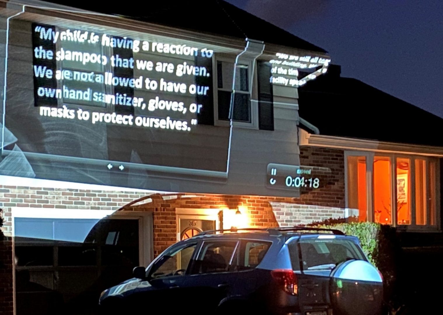 Protesters calling for the release of families held at the Berks Detention Center used a projector to illuminate the outside of Berks County Commissioner Michael Rivera's home on Monday, June 29, 2020.